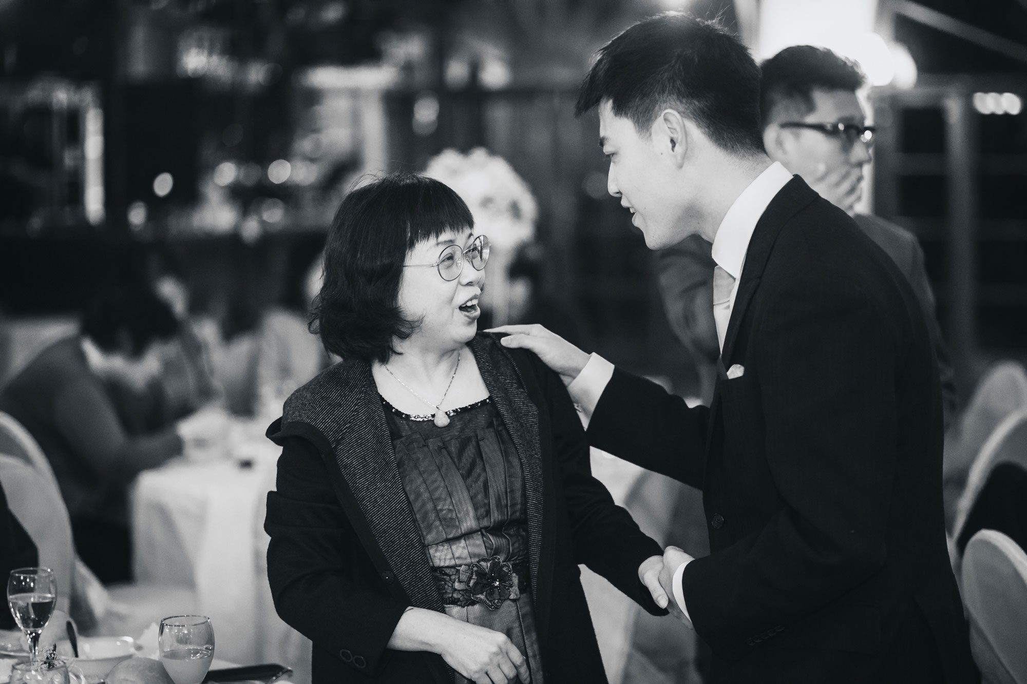 groom talking to guests