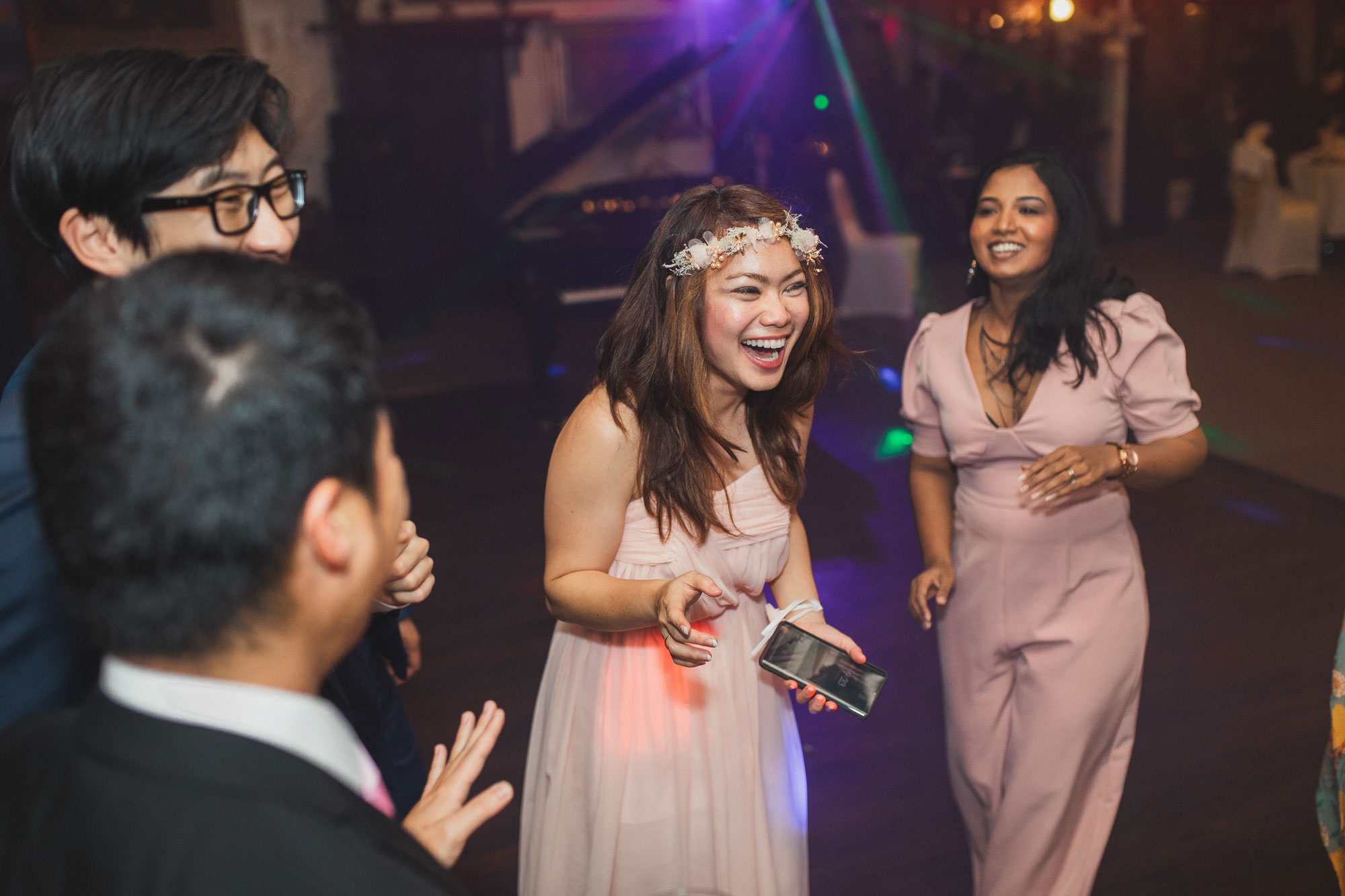 wedding guests laughing and partying
