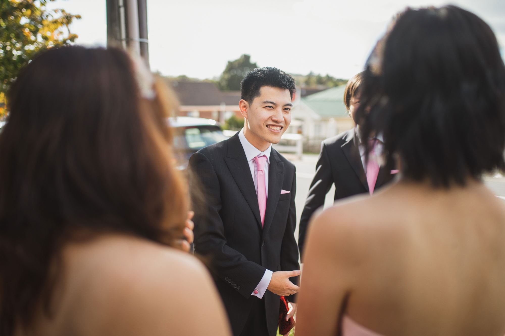 groom listening to the girls