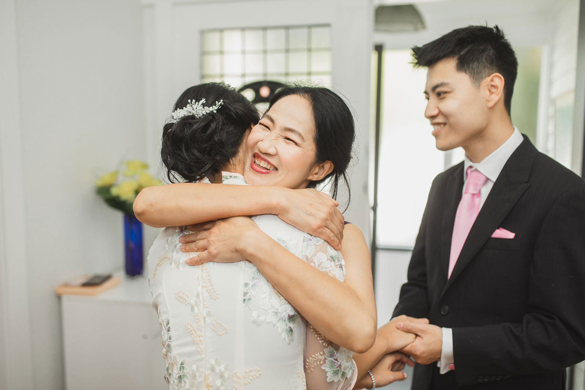 bride and mother hug