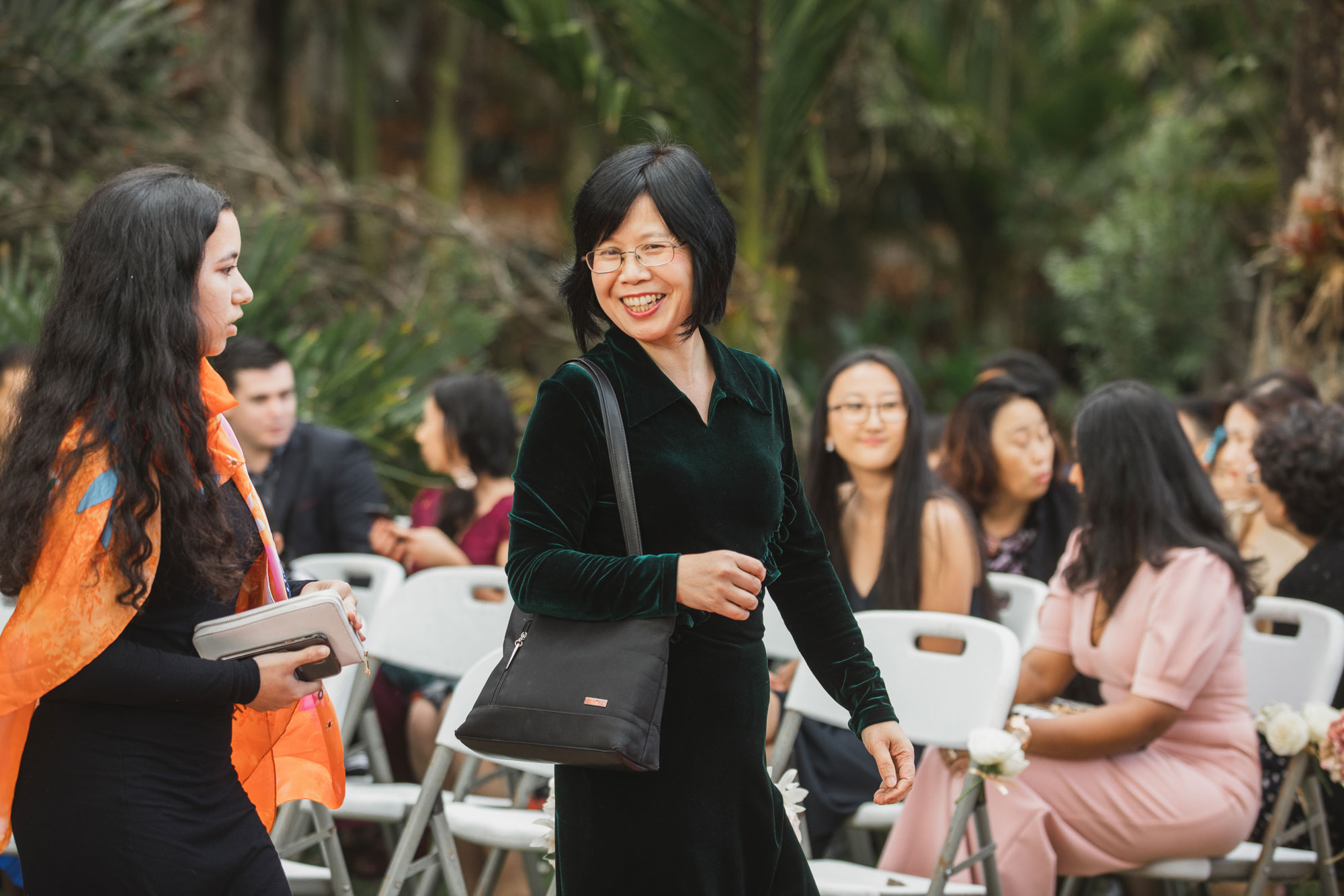 wedding guest smiling at each other