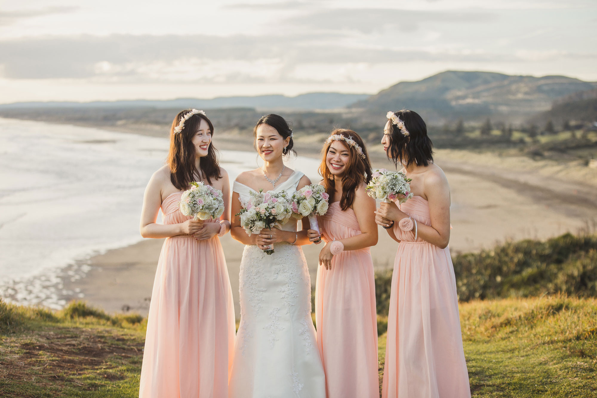 bridal party talking at muriwai