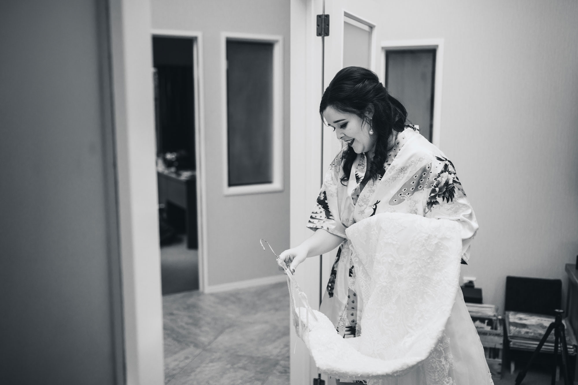 bride looking at her wedding dress