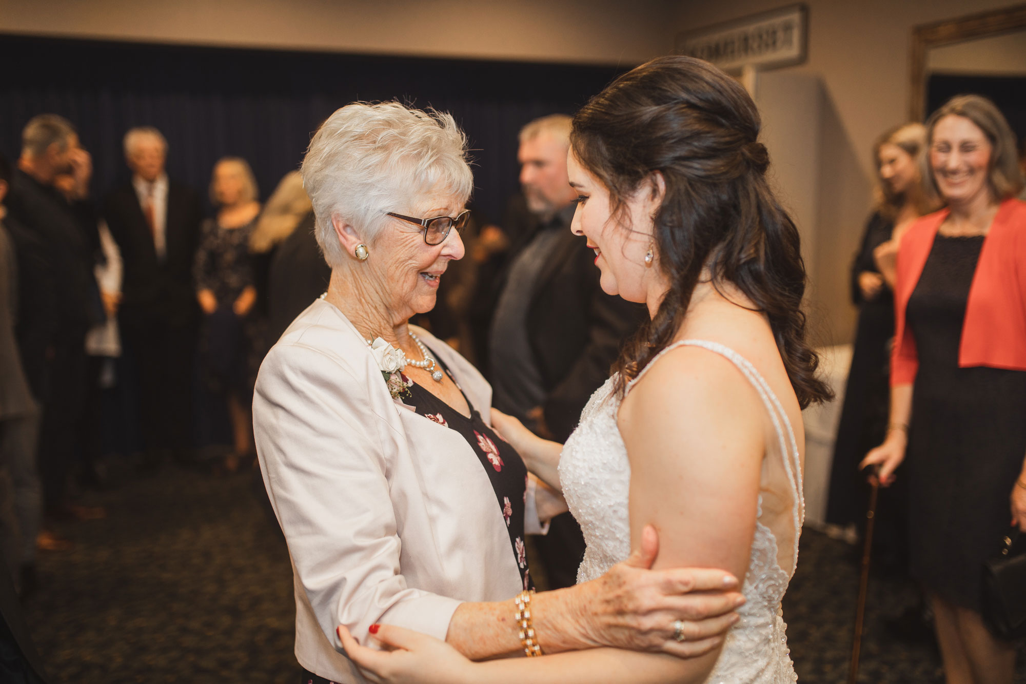 moment between bride and family