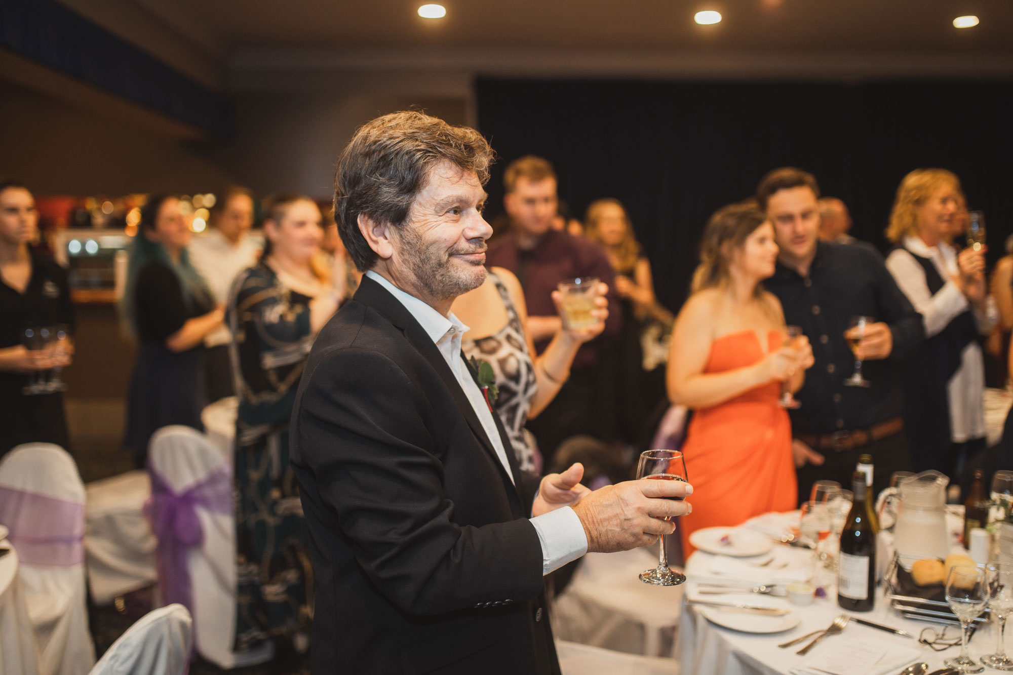 family members cheering at the wedding