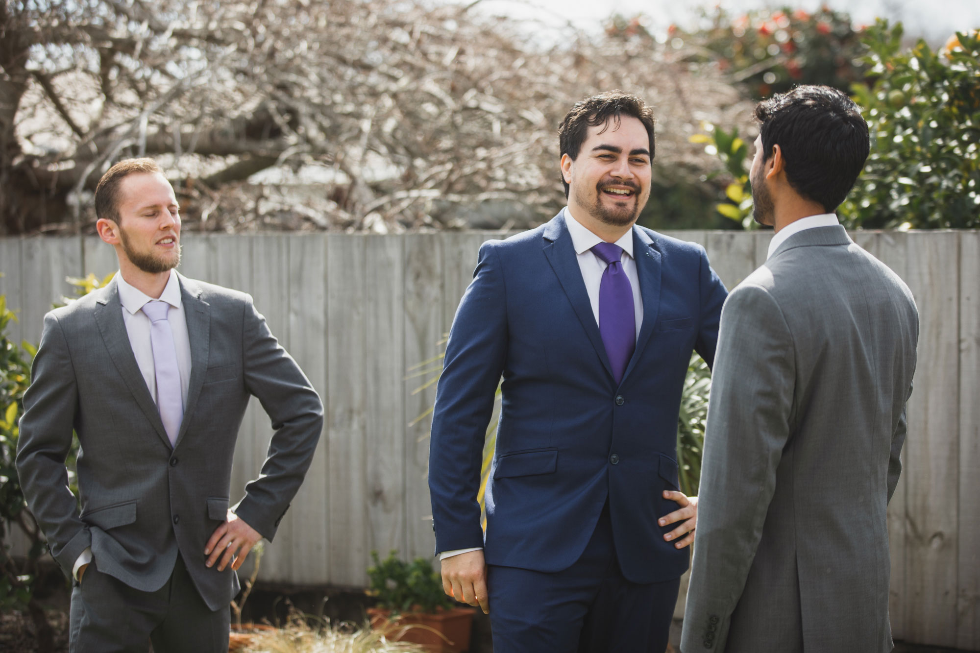 groom and groomsmen laughing