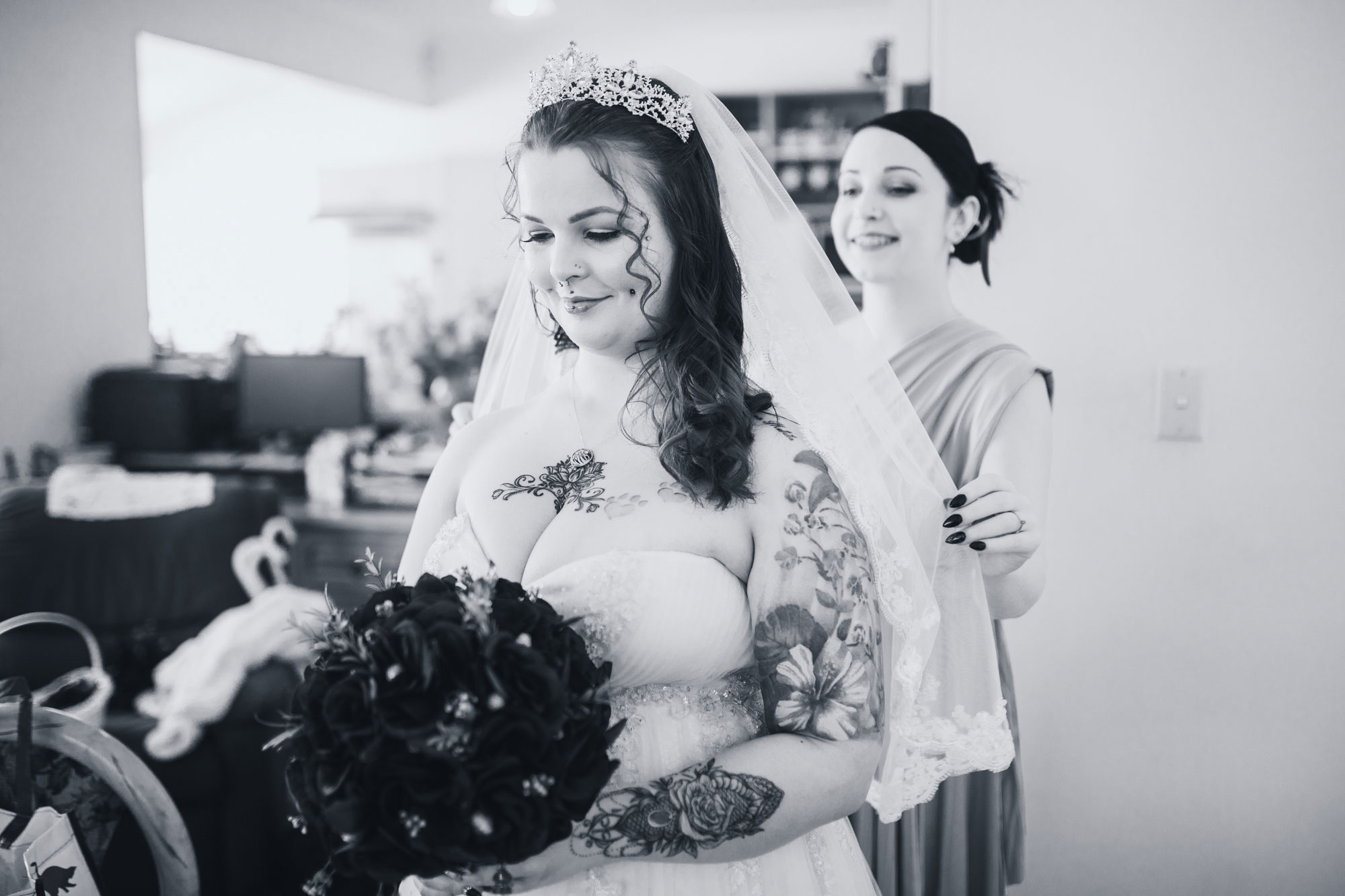 bride putting on veil