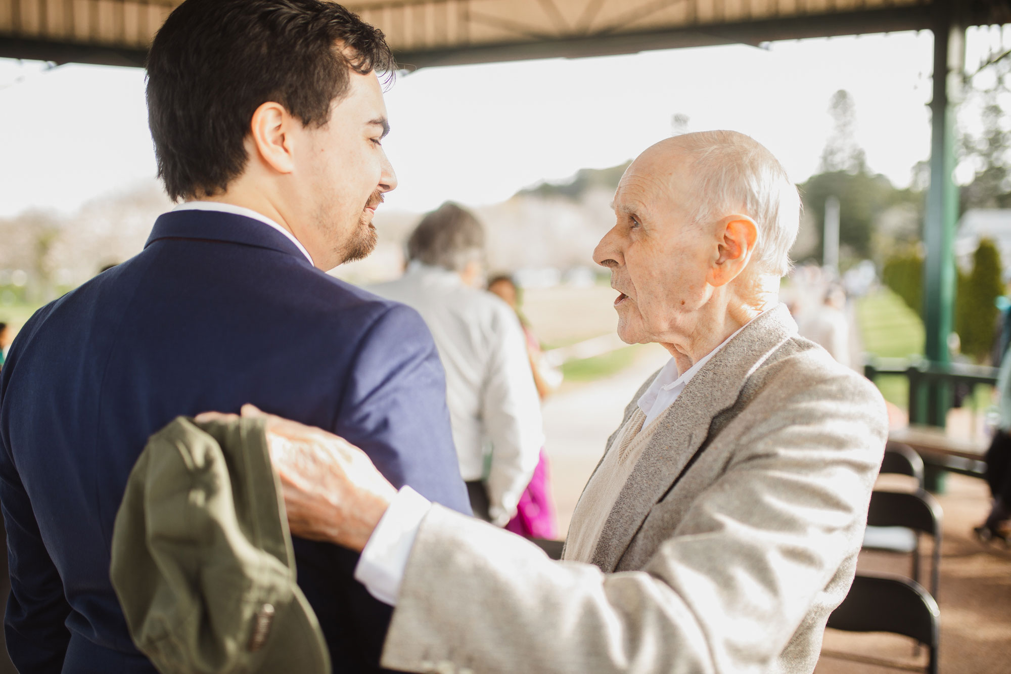 grand dad hugging the groom