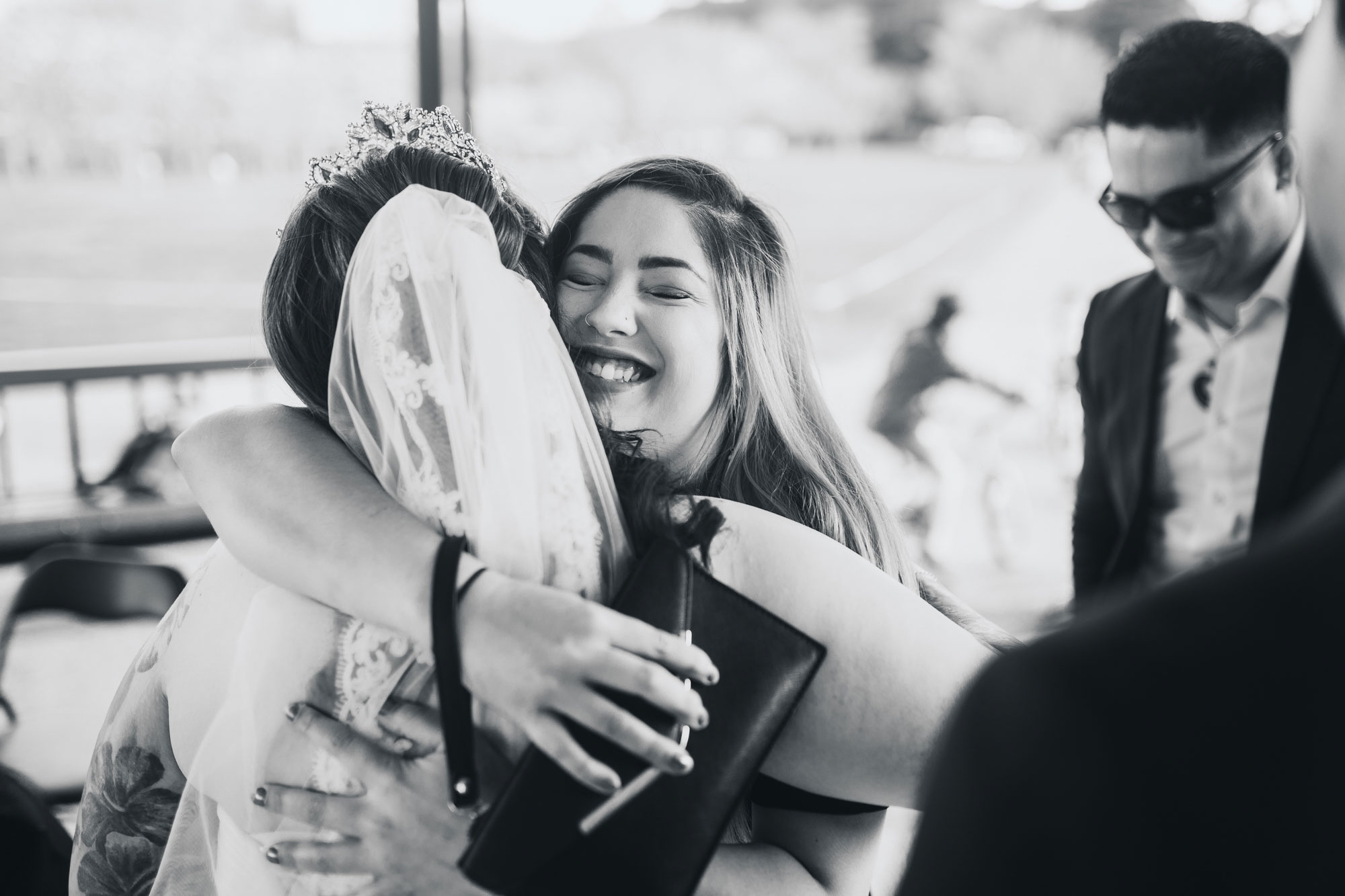 weddings guests smiling and hugging