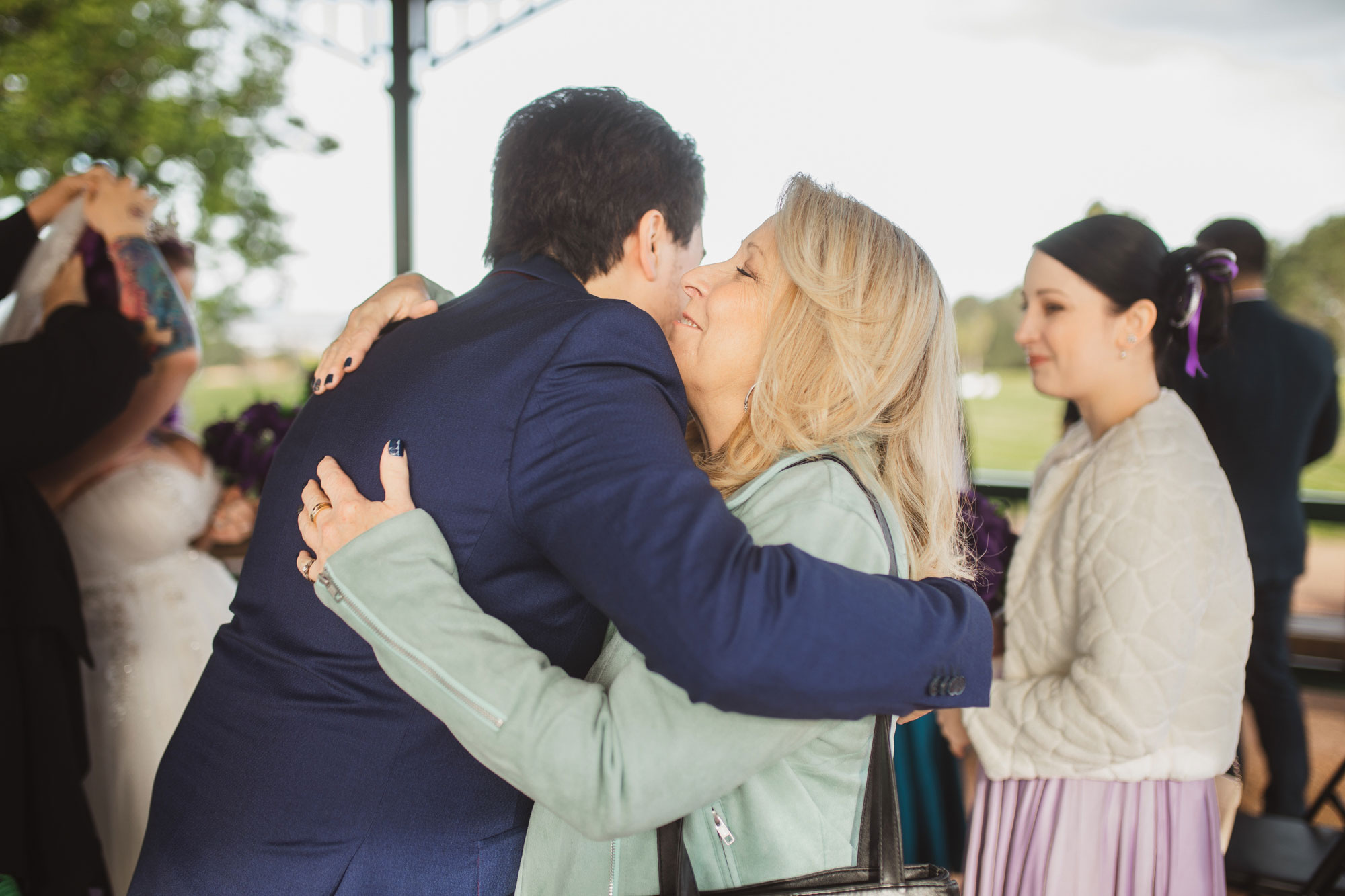 hugging the groom