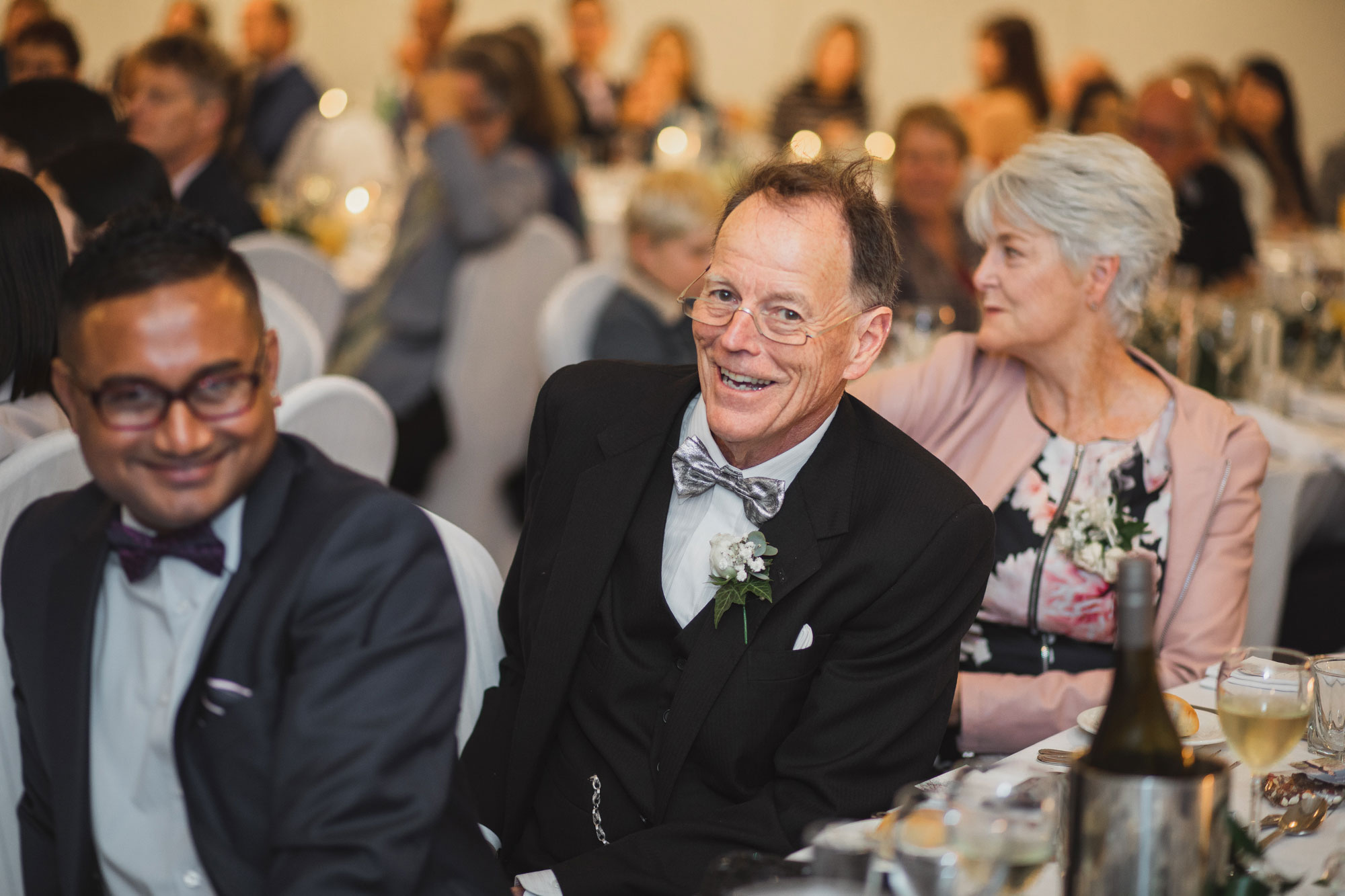 father of the groom smiling