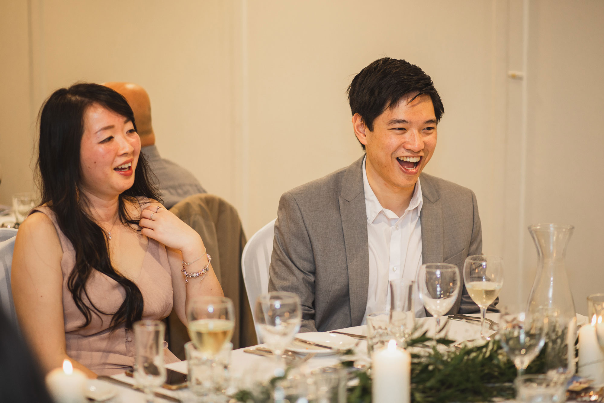 wedding guests laughing