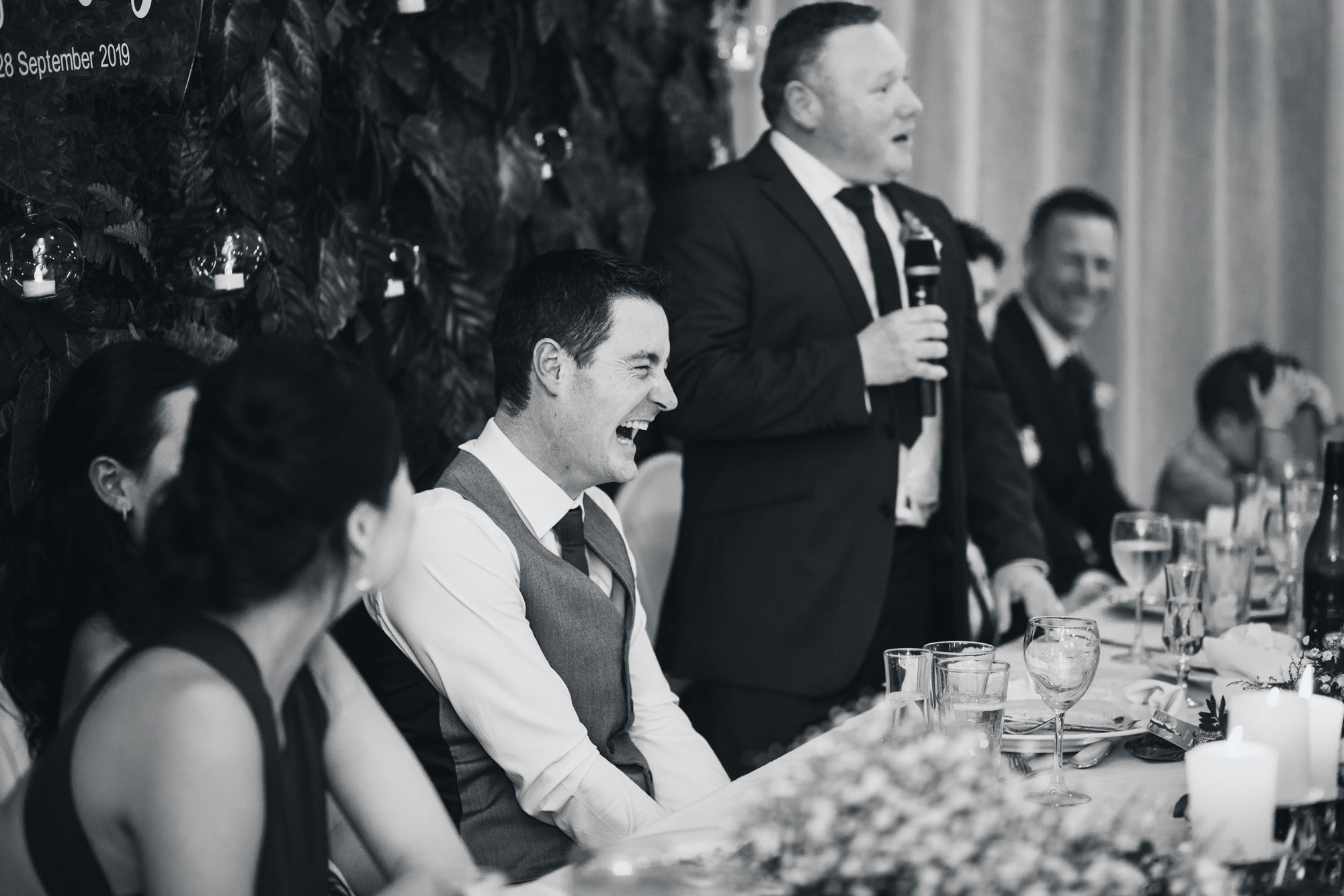 groom reacting to bestman speech