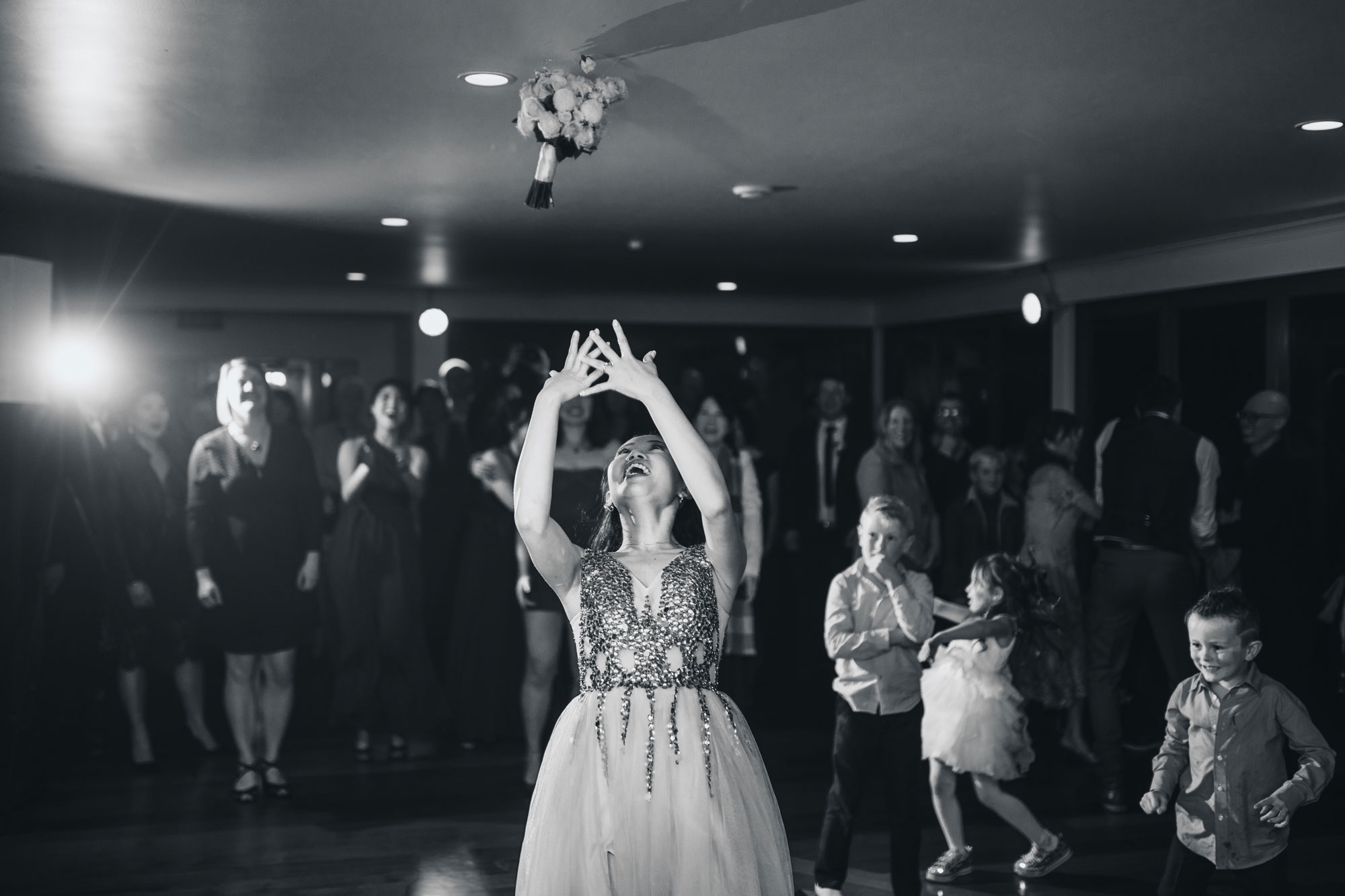 bride tossing bouquet at castaways wedding