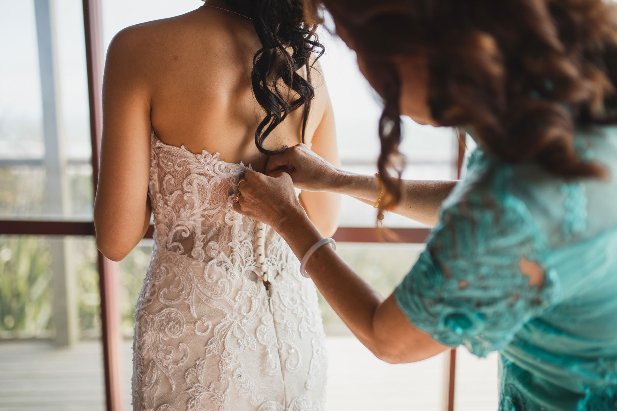 bride getting into her dress