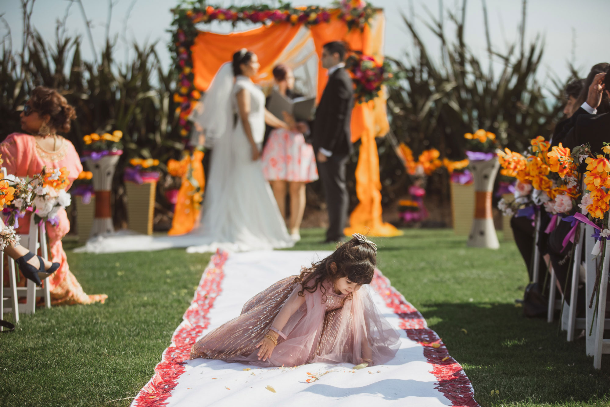 girl playing at the wedding ceremony