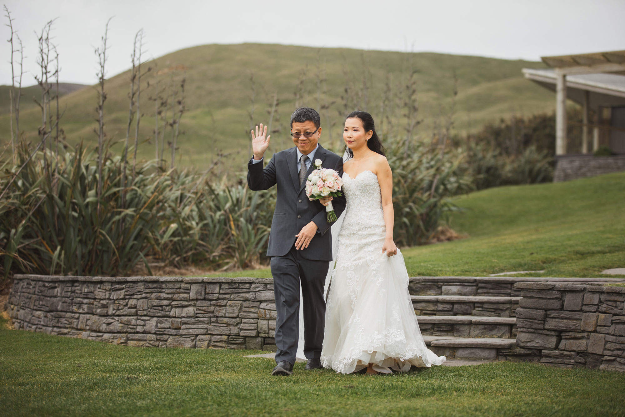 bride walking down the aisle with father