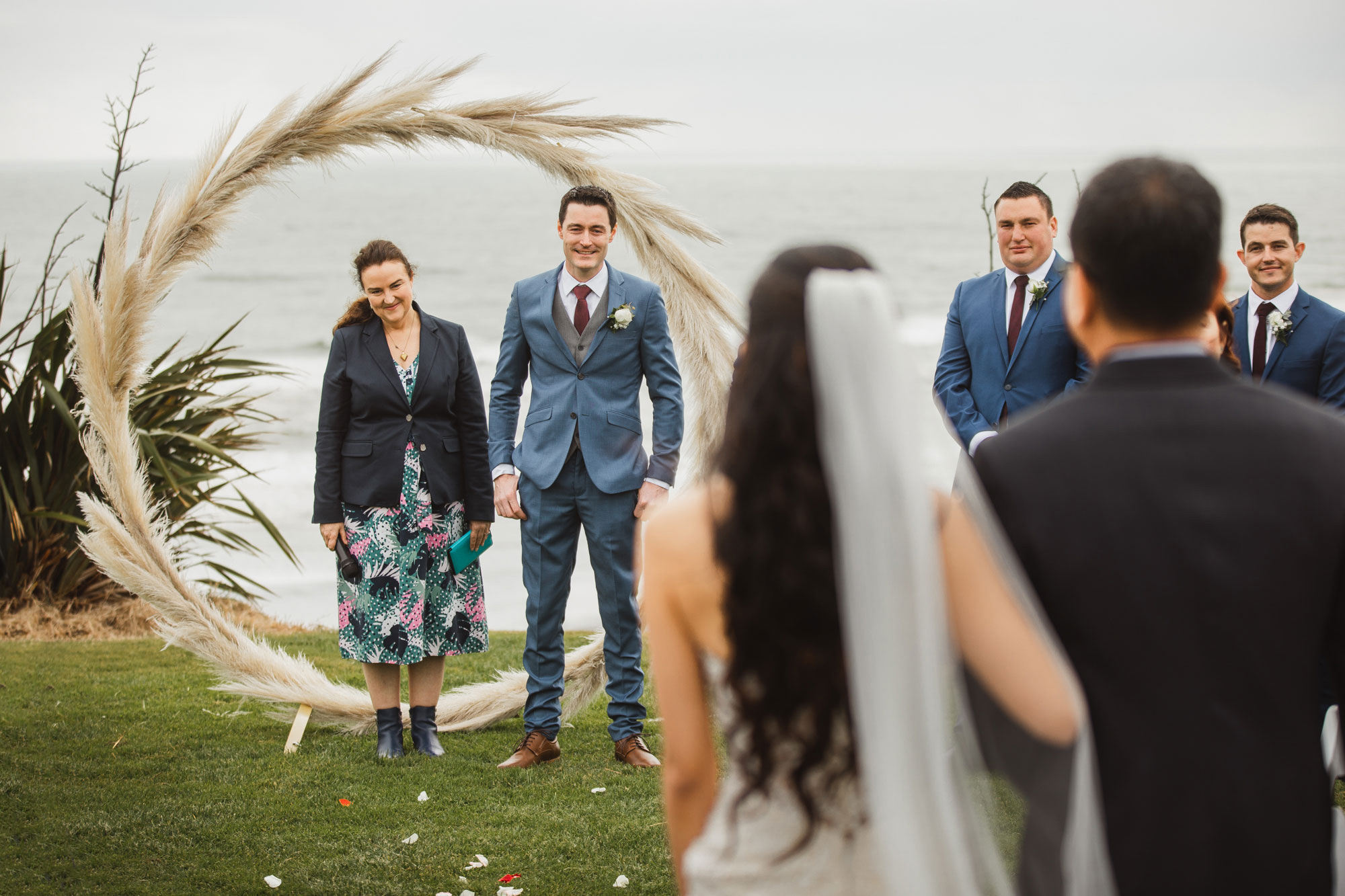 groom looking at the bride