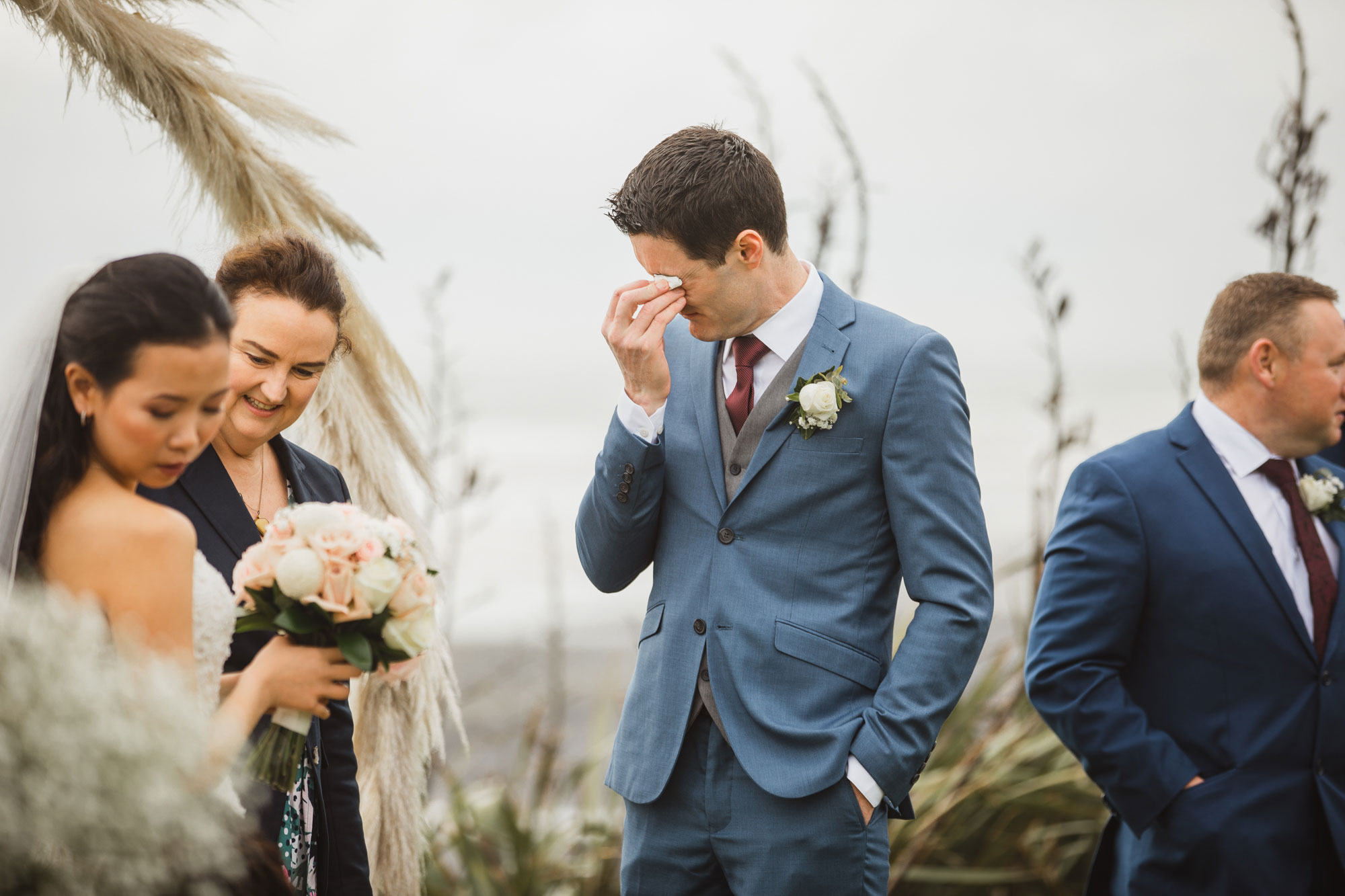 groom crying at the ceremony