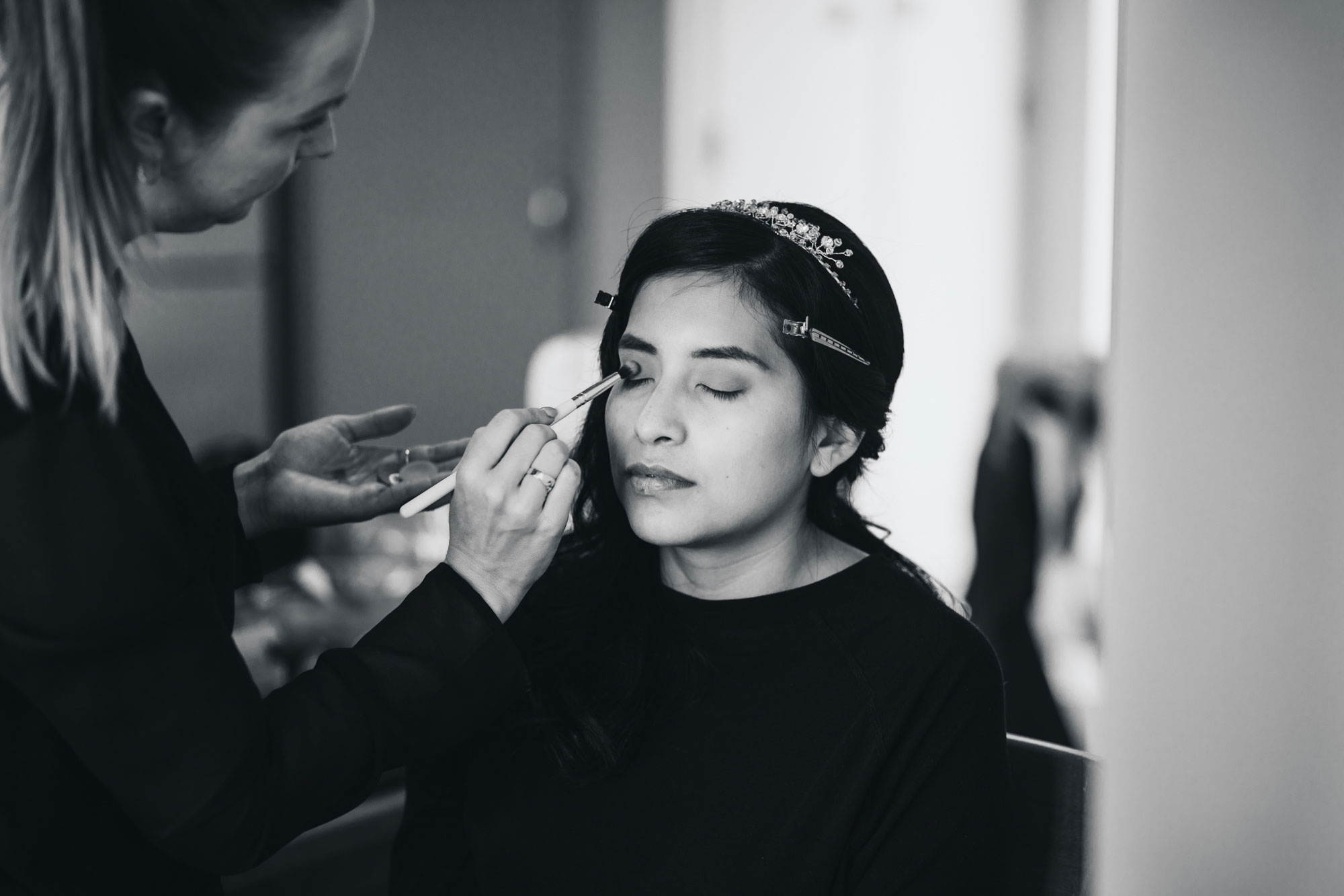 bride doing make up