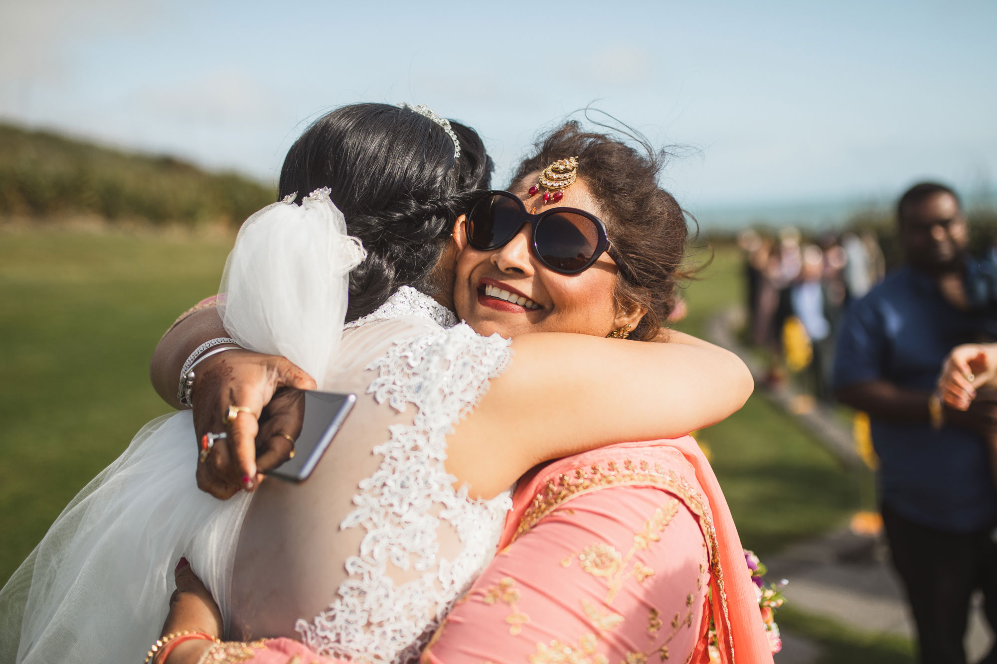 mother hugging bride