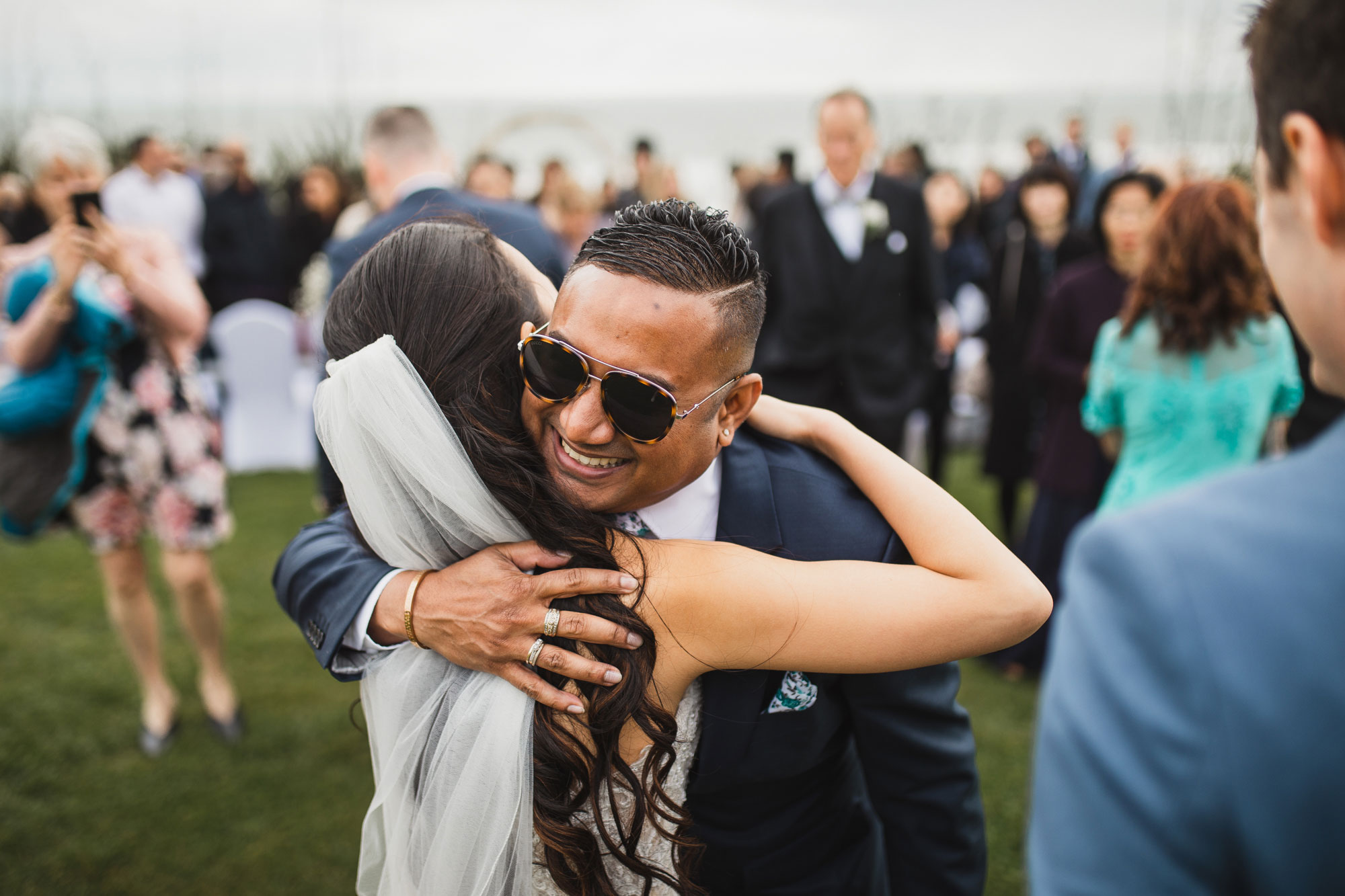 wedding guests hugging