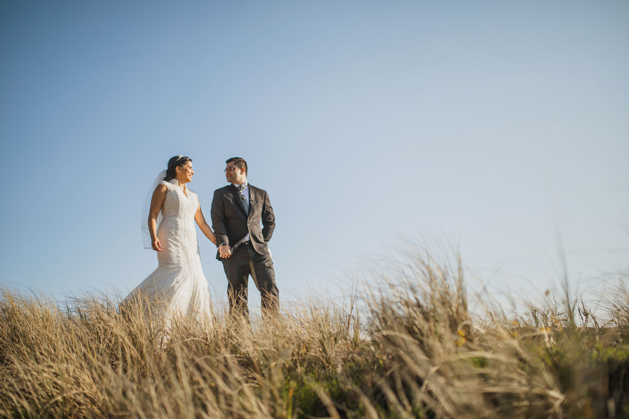 bride and groom at the dunes
