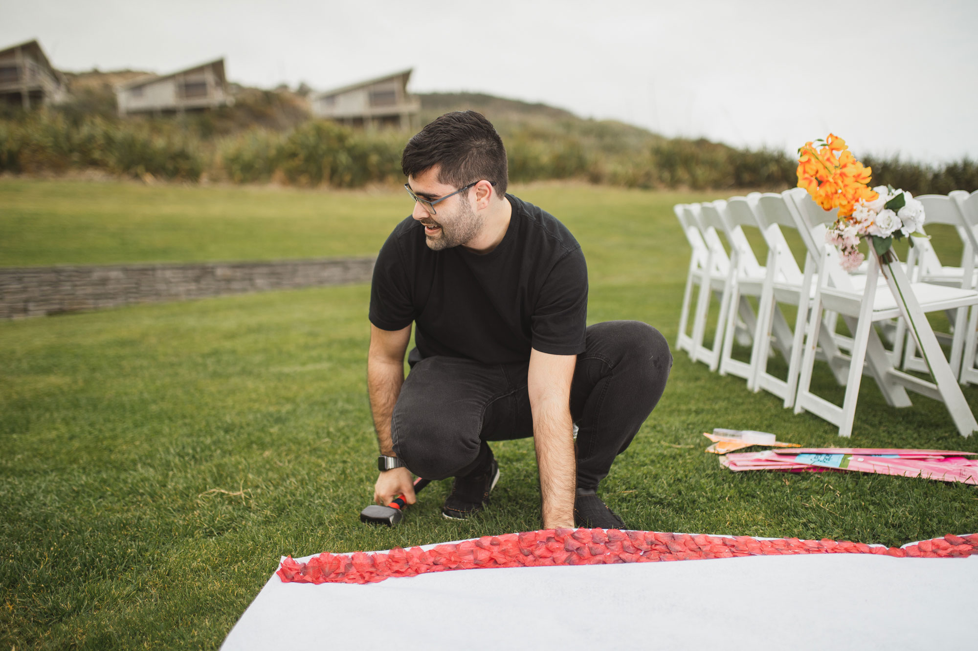 groom preparing ceremony site at castaways