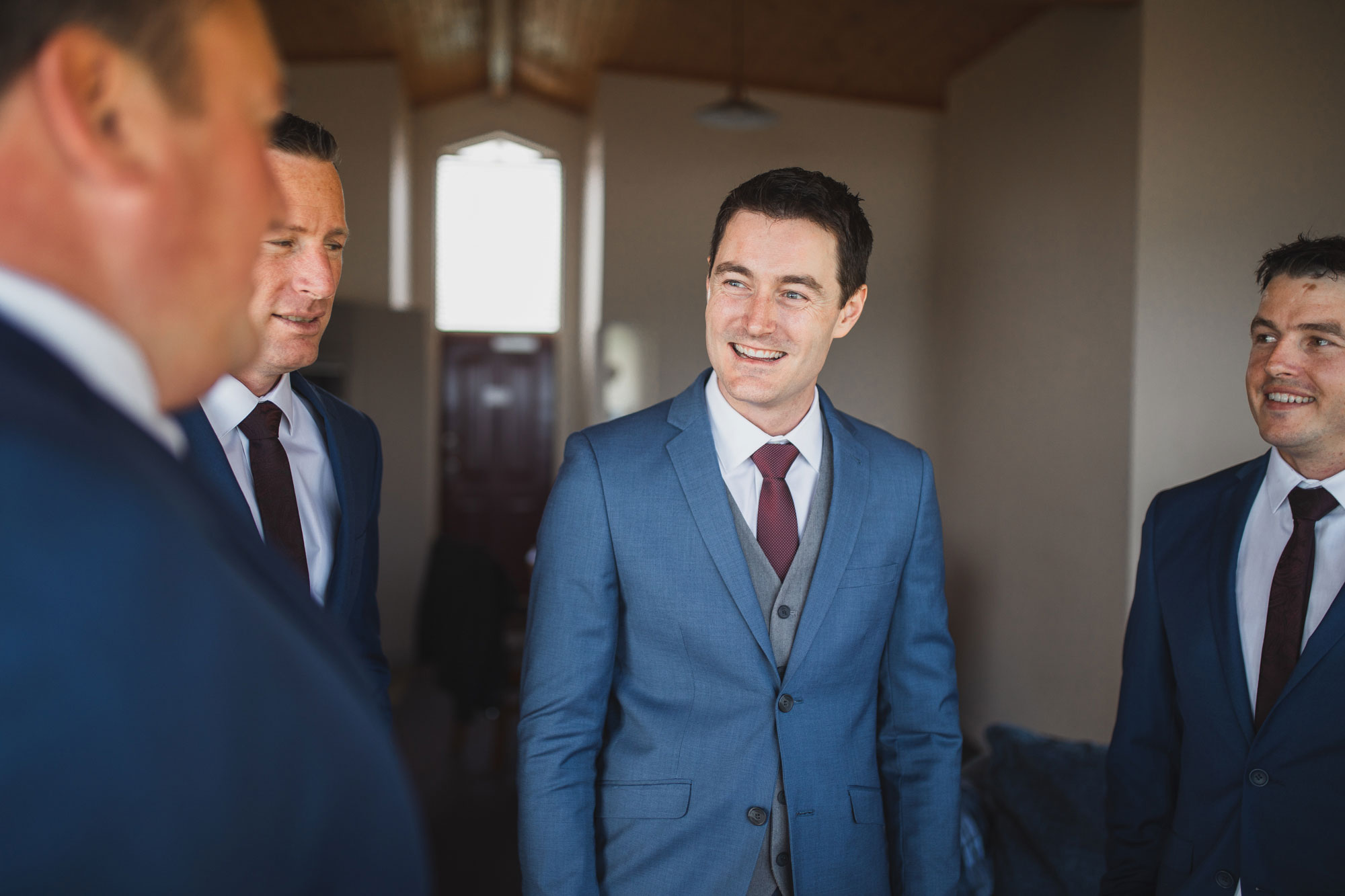 groom talking to groomsmen