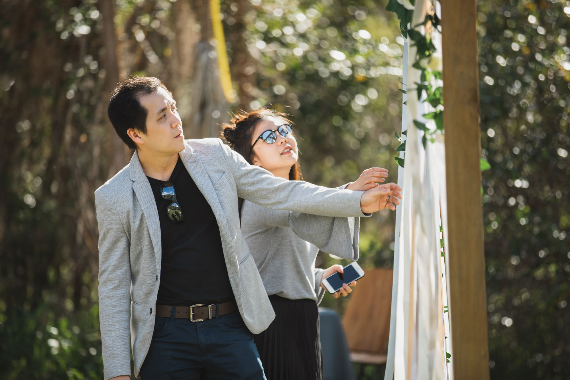 wedding guests looking at arch