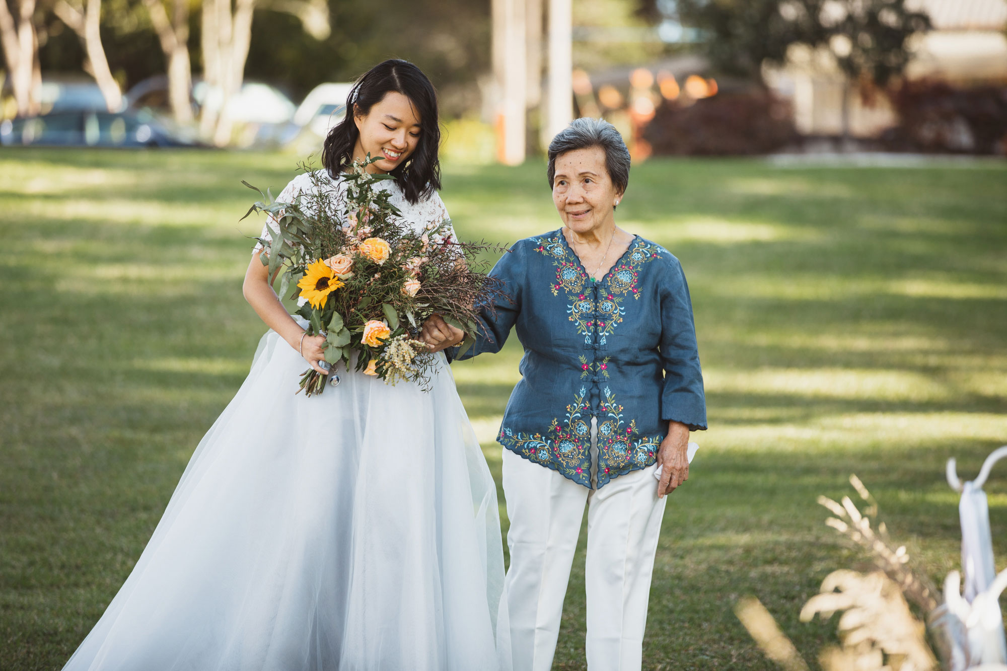 bride and grandmother walking down the aisle