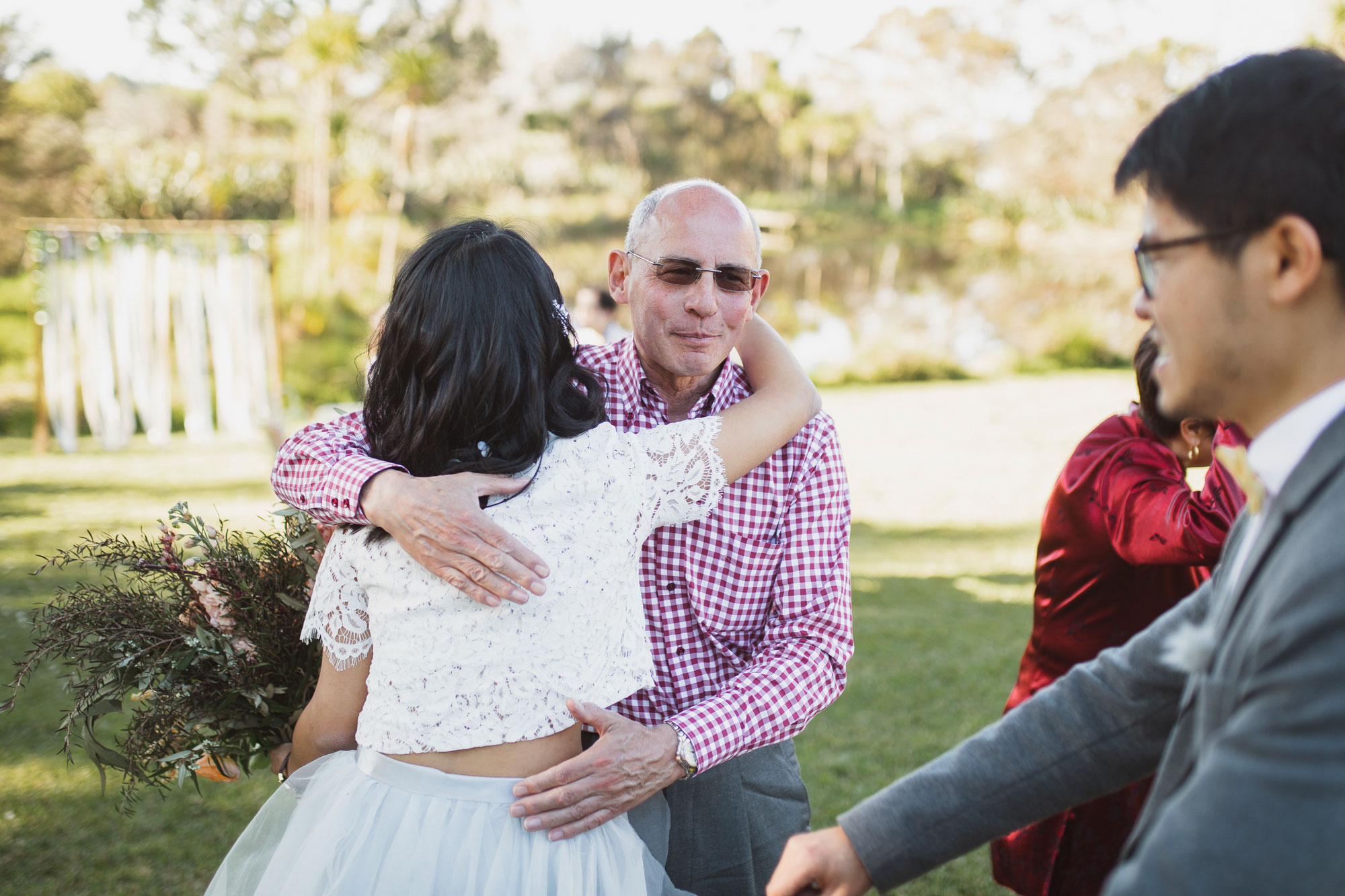 wedding guest hugging the bride