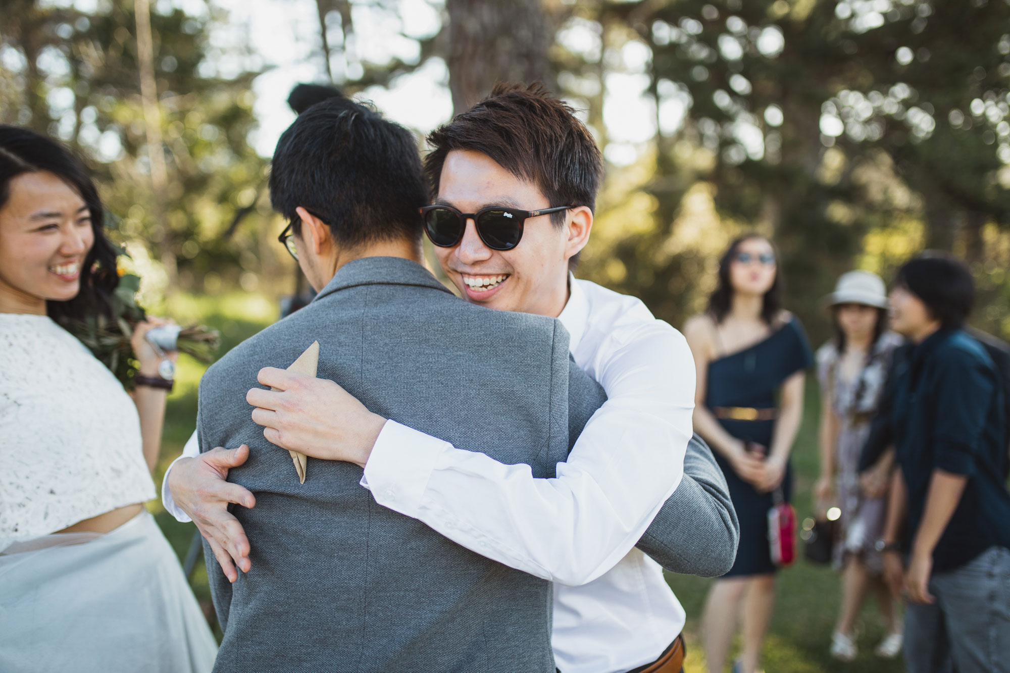 guest hugging the groom