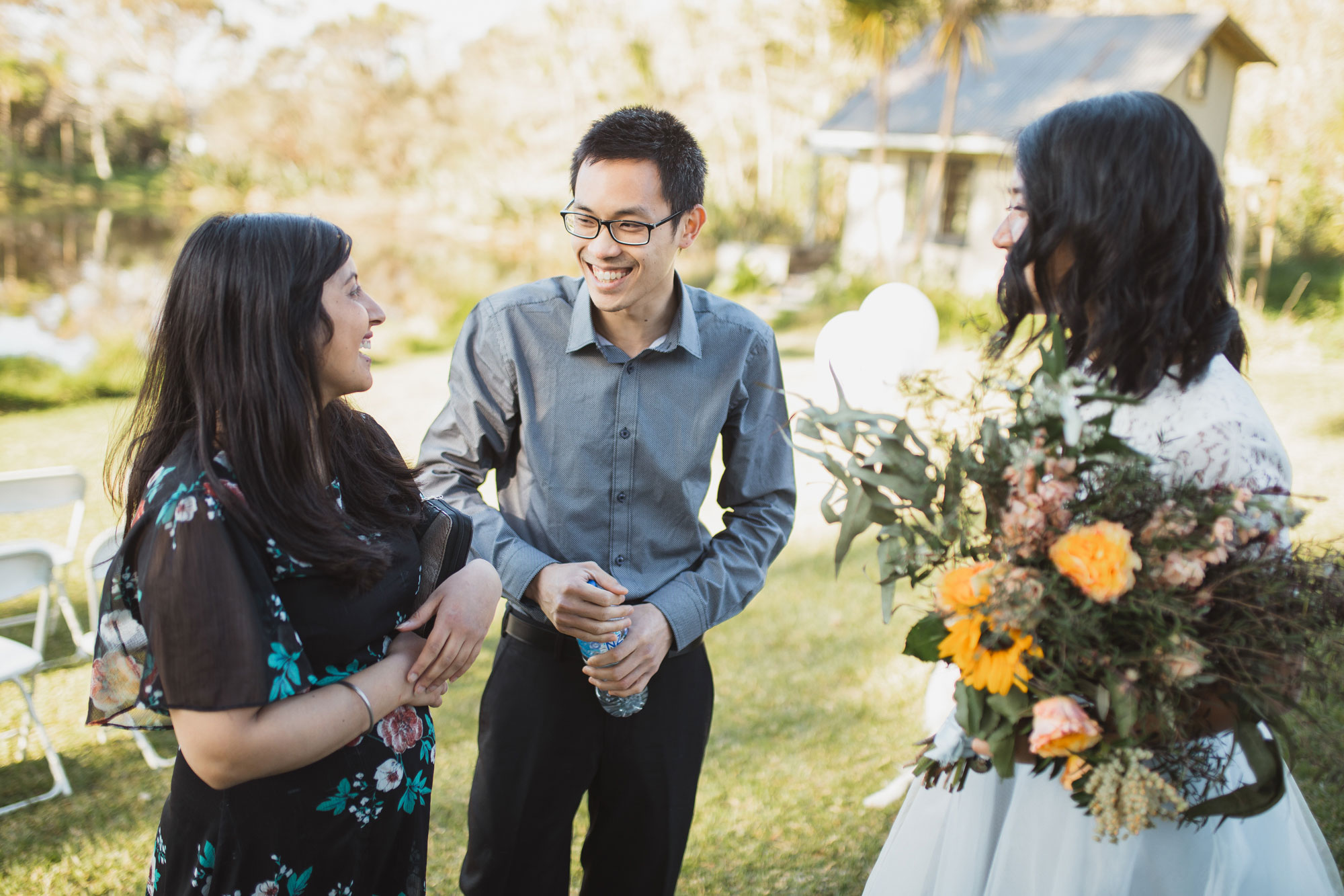 wedding guests and bride laughing