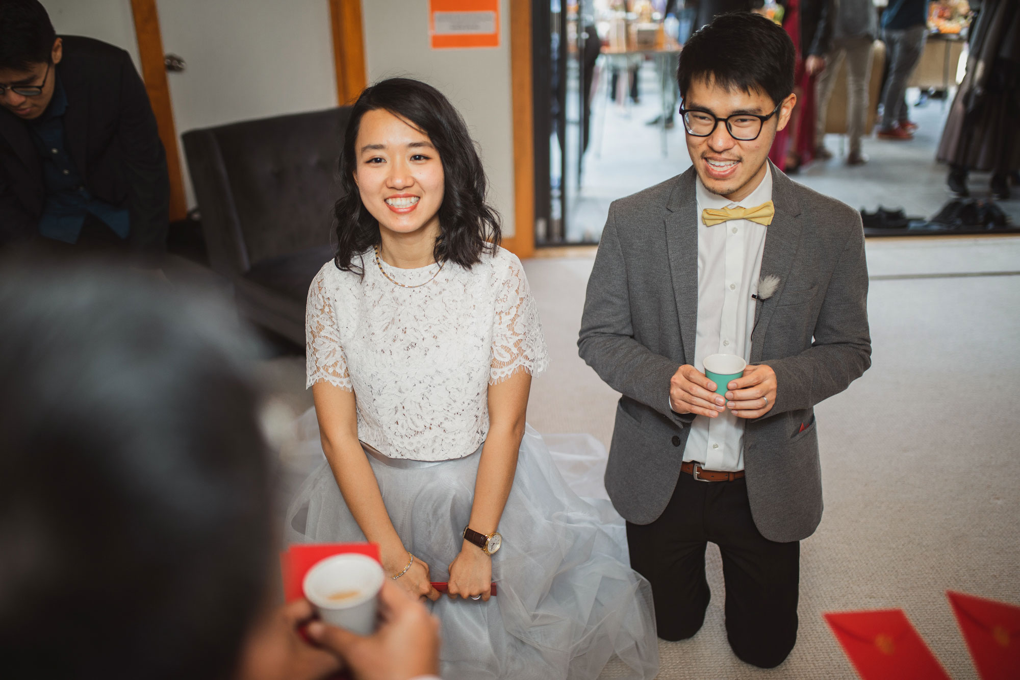 bride and groom offering tea to elders