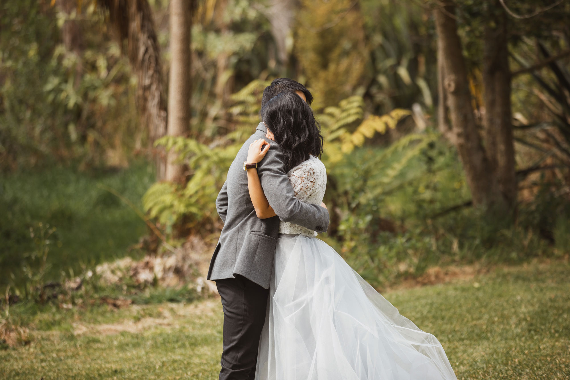 auckland wedding bride and groom embrace