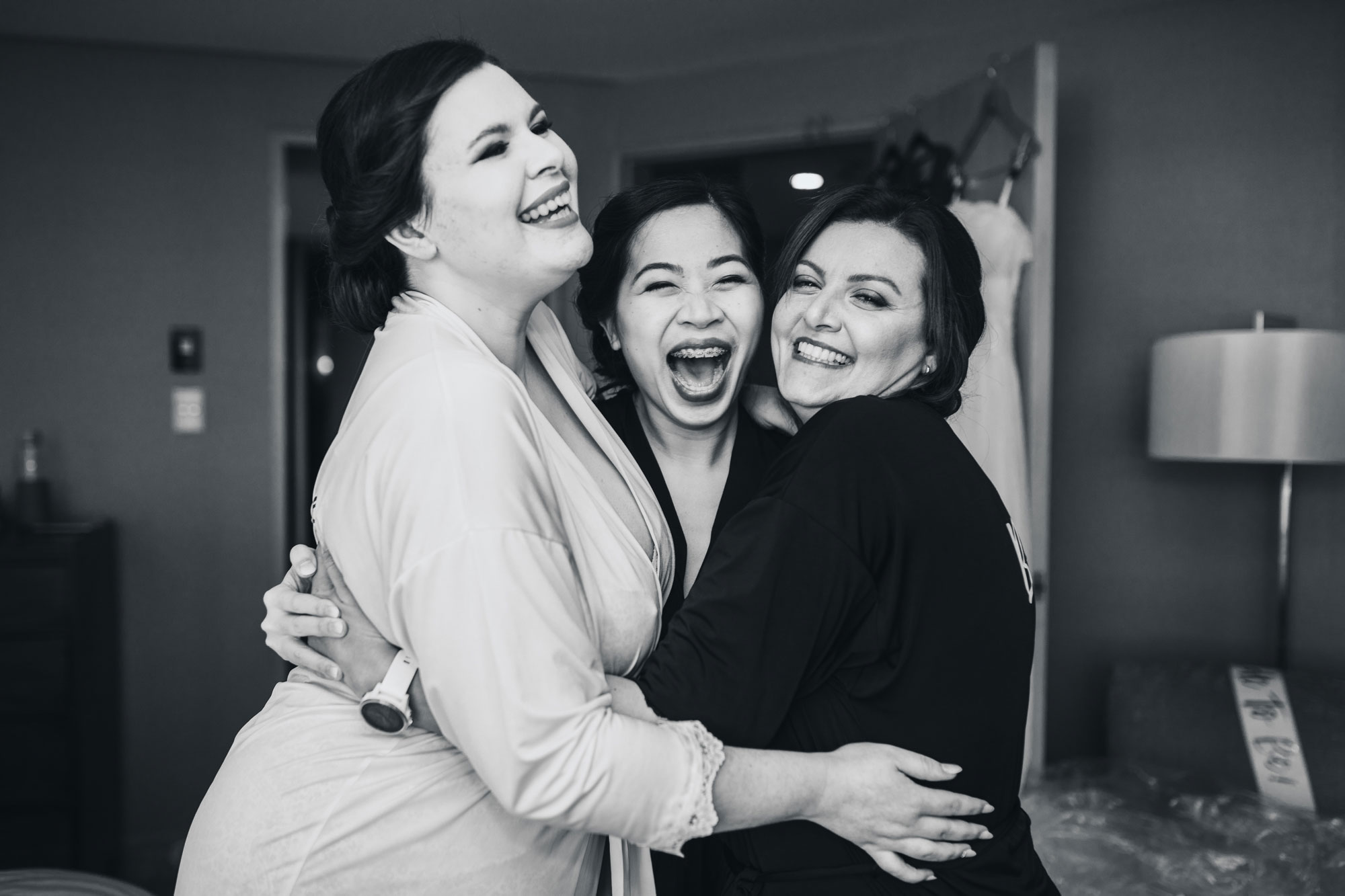 bride and bridesmaids having fun