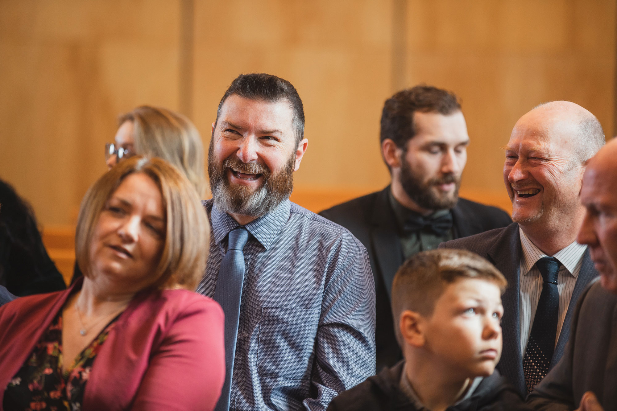 wedding guests laughing