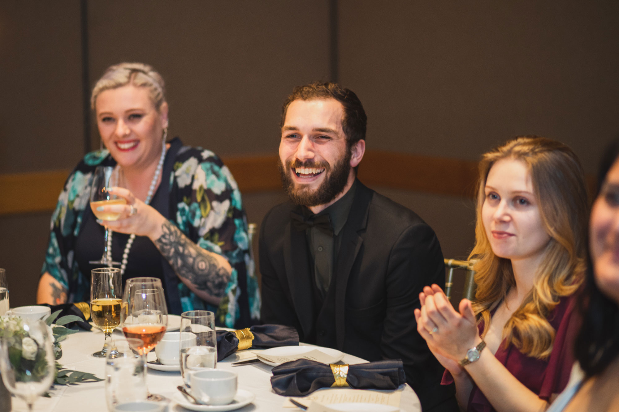 wedding guests laughing at speeches