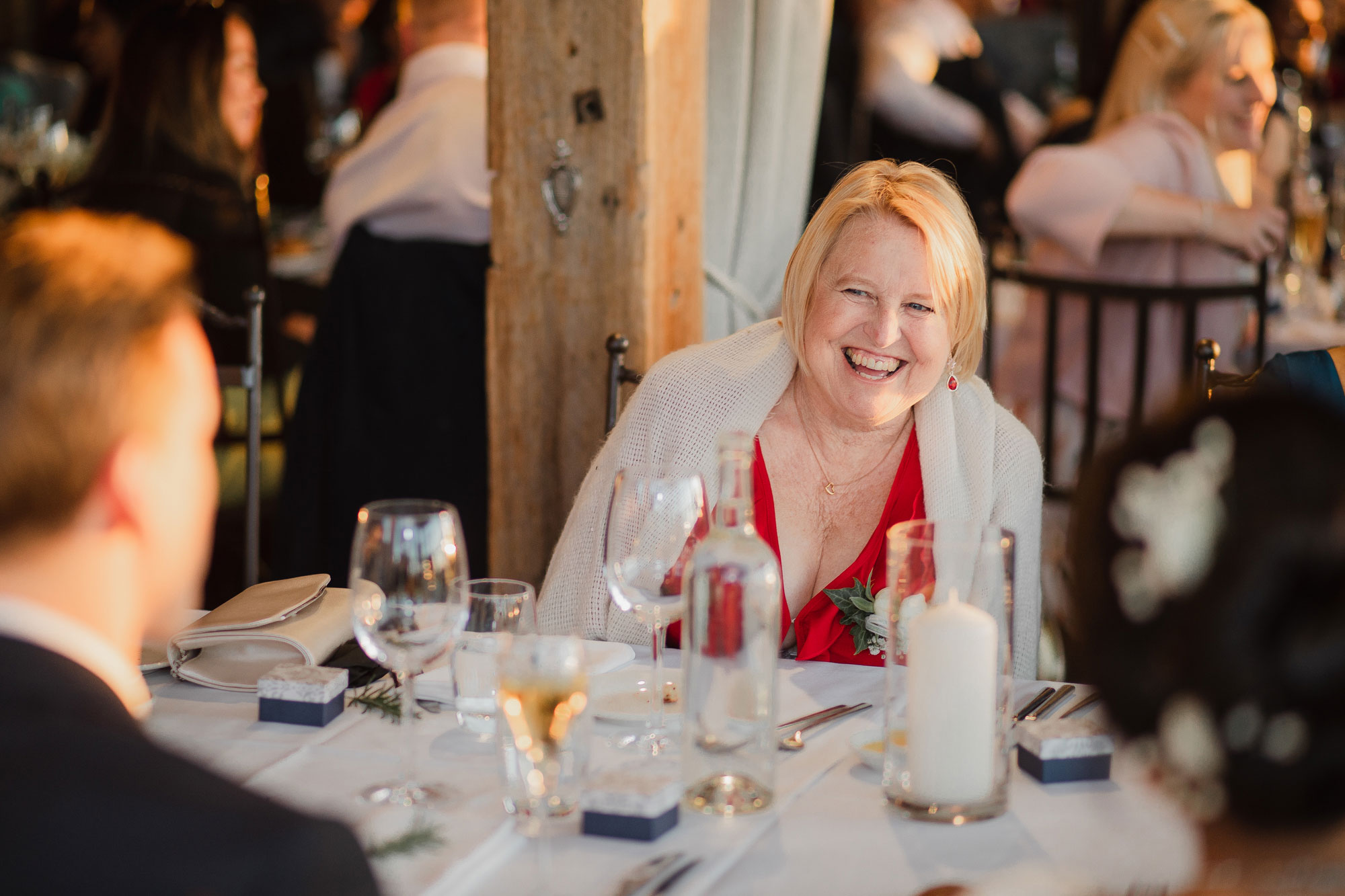 mother of the groom laughing