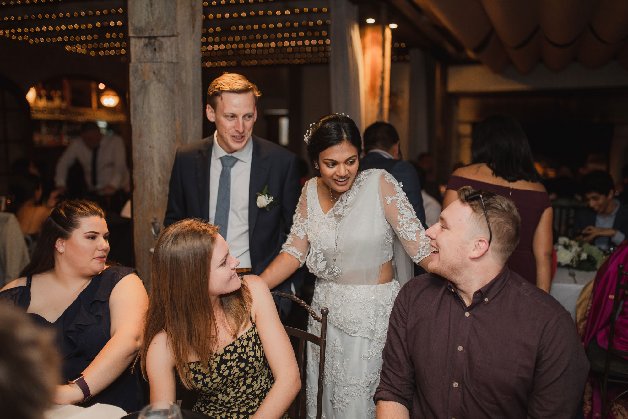 bride and groom chatting with guests