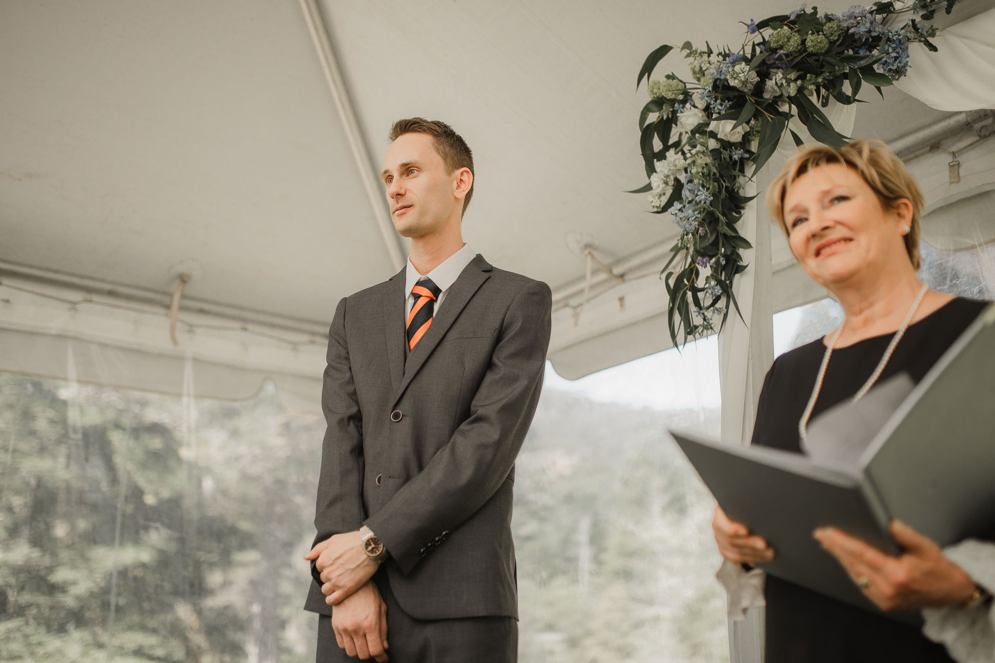 groom looking at the bride