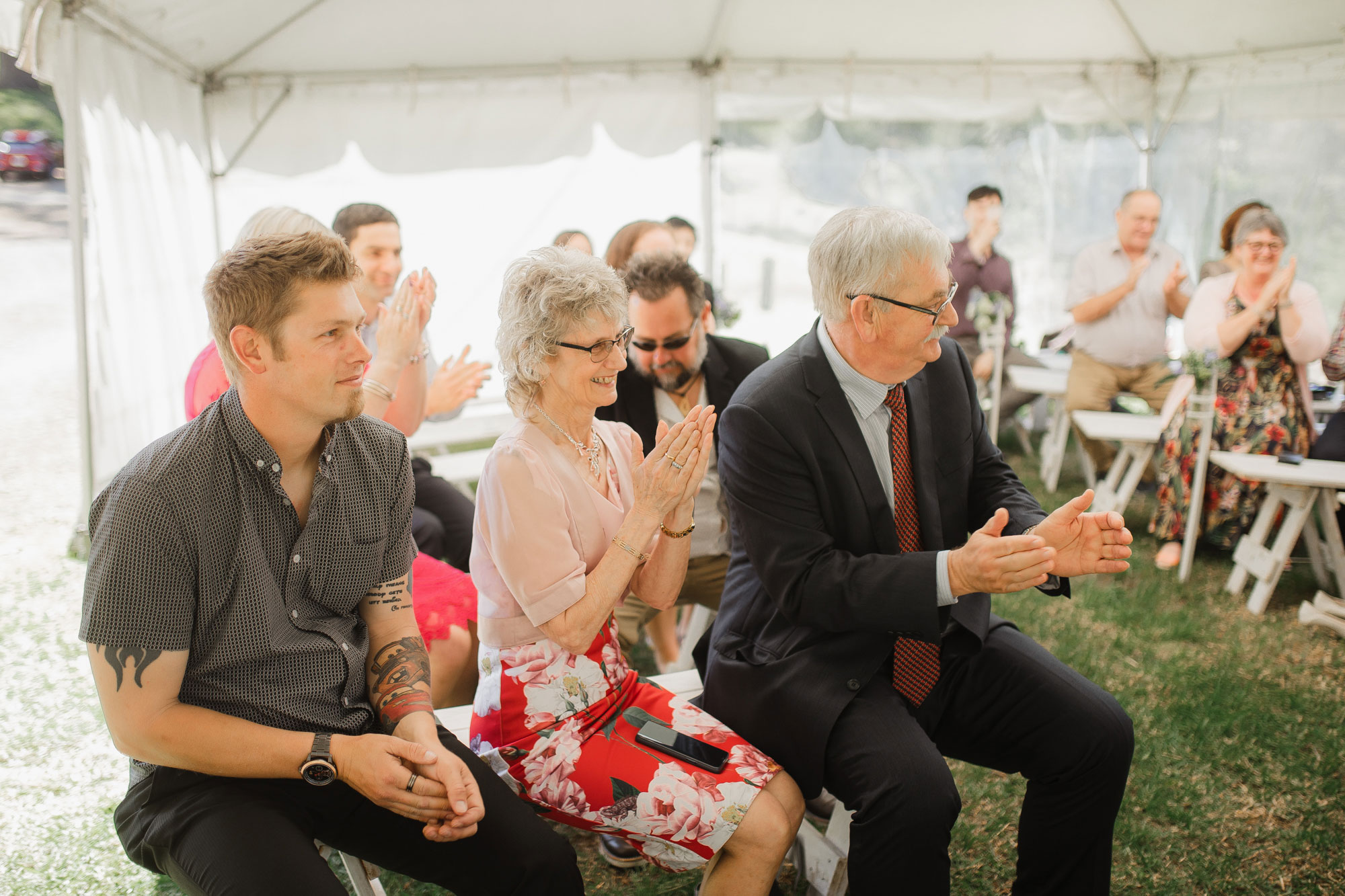 parents of the groom clapping