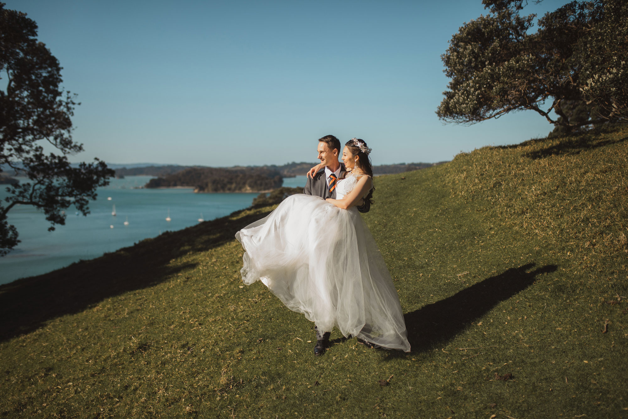 groom carrying the bride