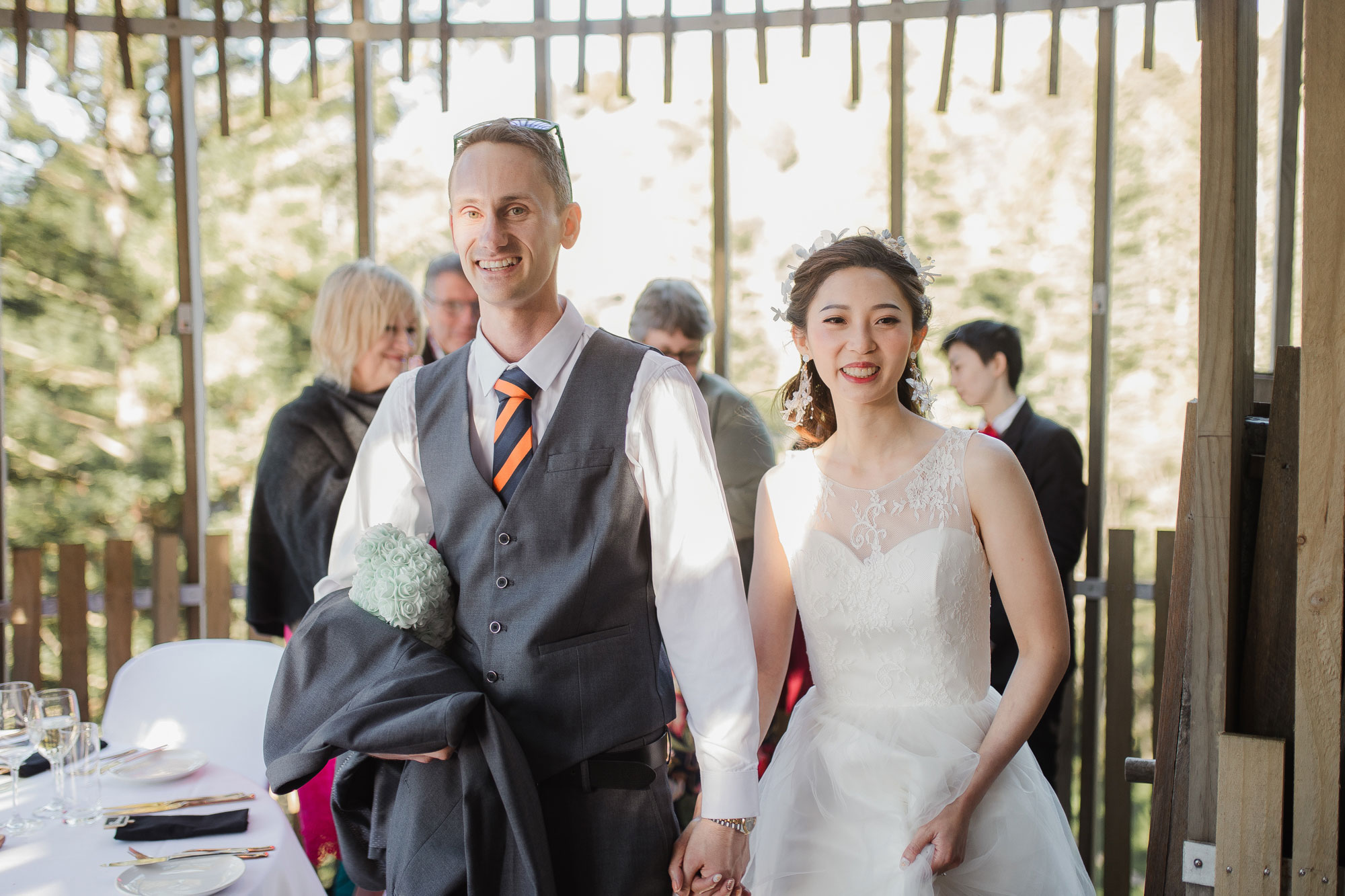 bride and groom enter wedding reception