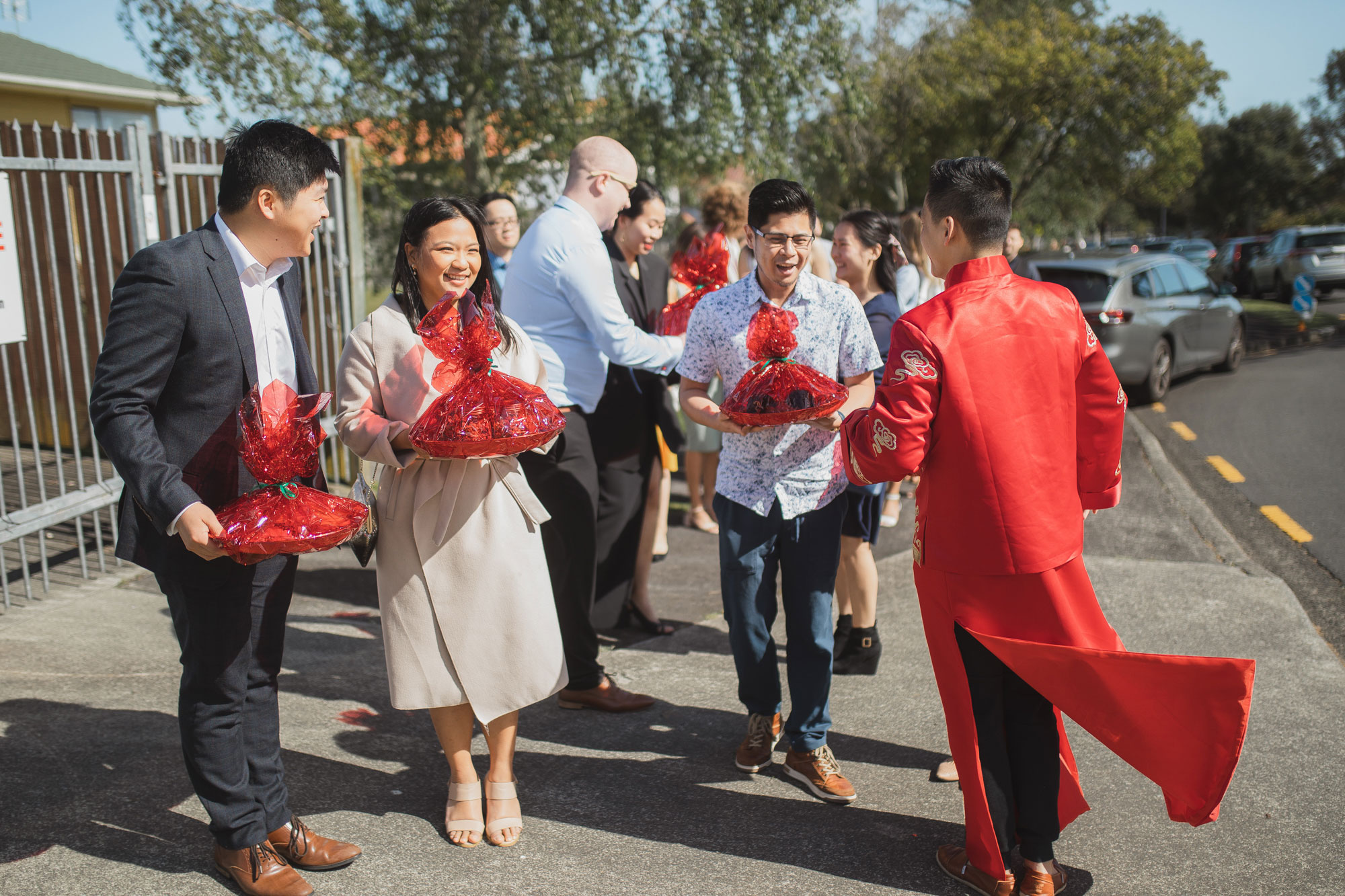 groom and friends bringing gifts