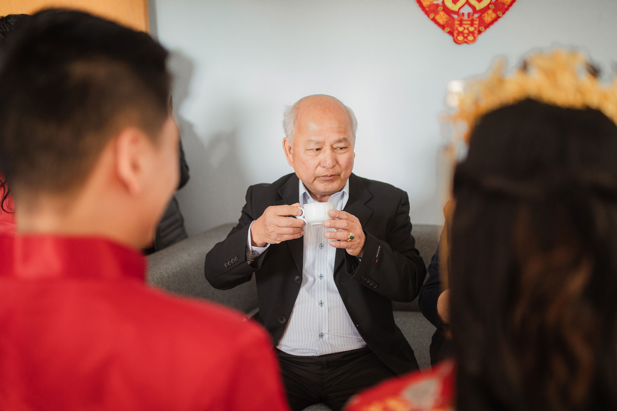 father of the bride drinking tea