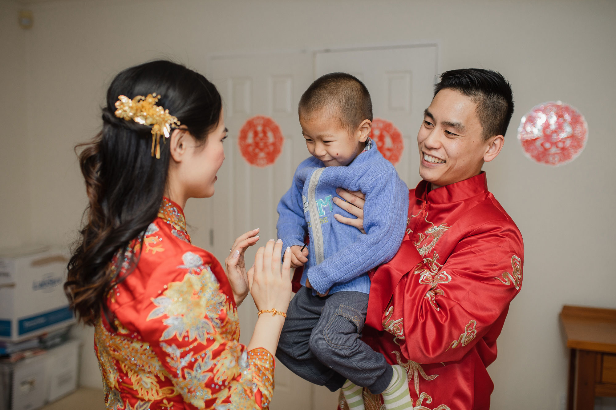 bride and groom with a boy