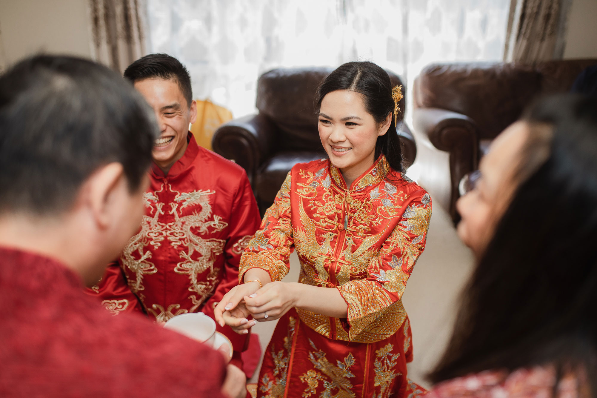 bride offering tea to parents