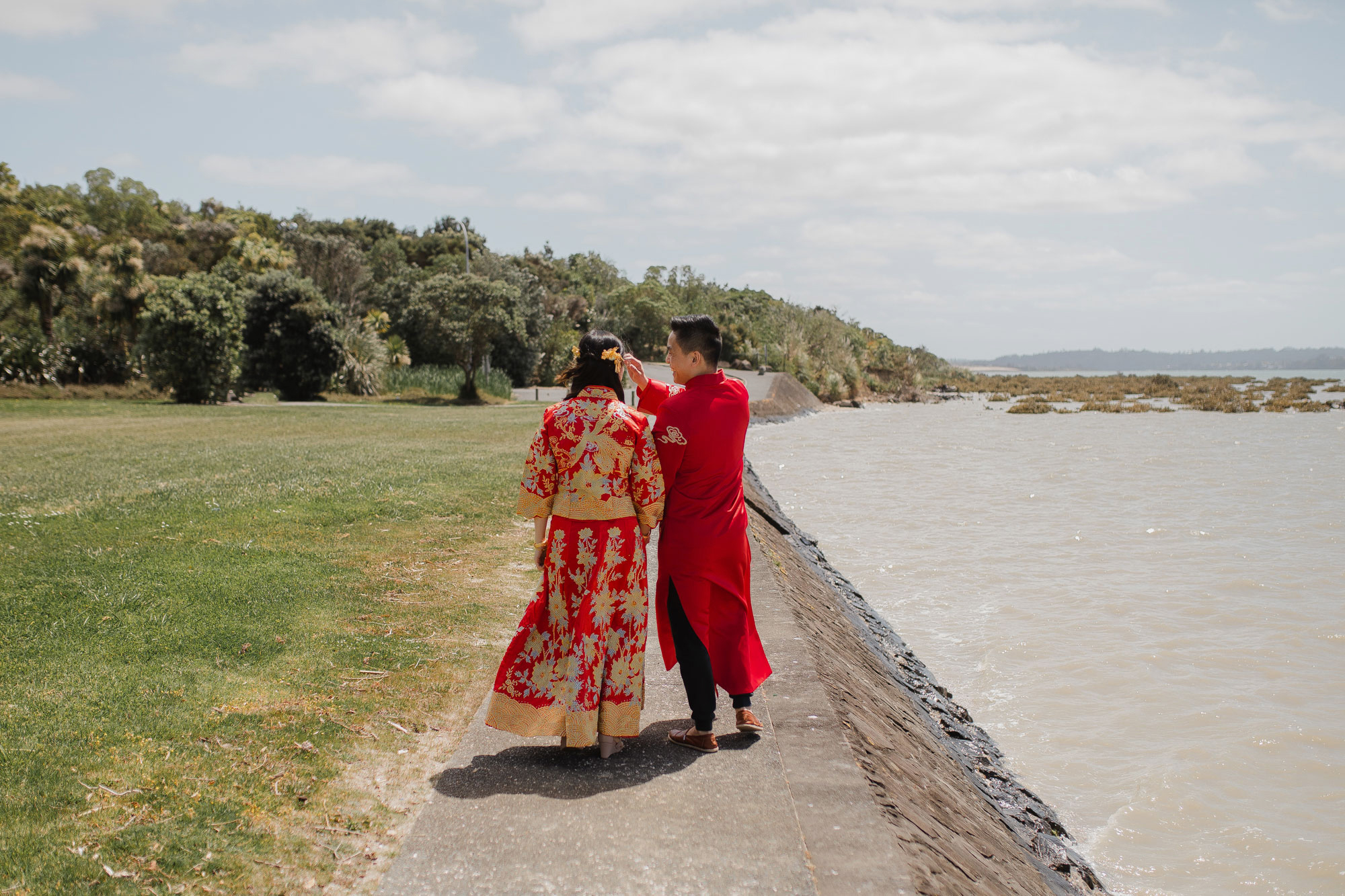 bride and groom in traditional chinese wedding outfits